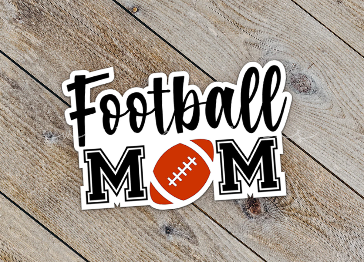 Close-up of the Football Mom sticker on rustic wood