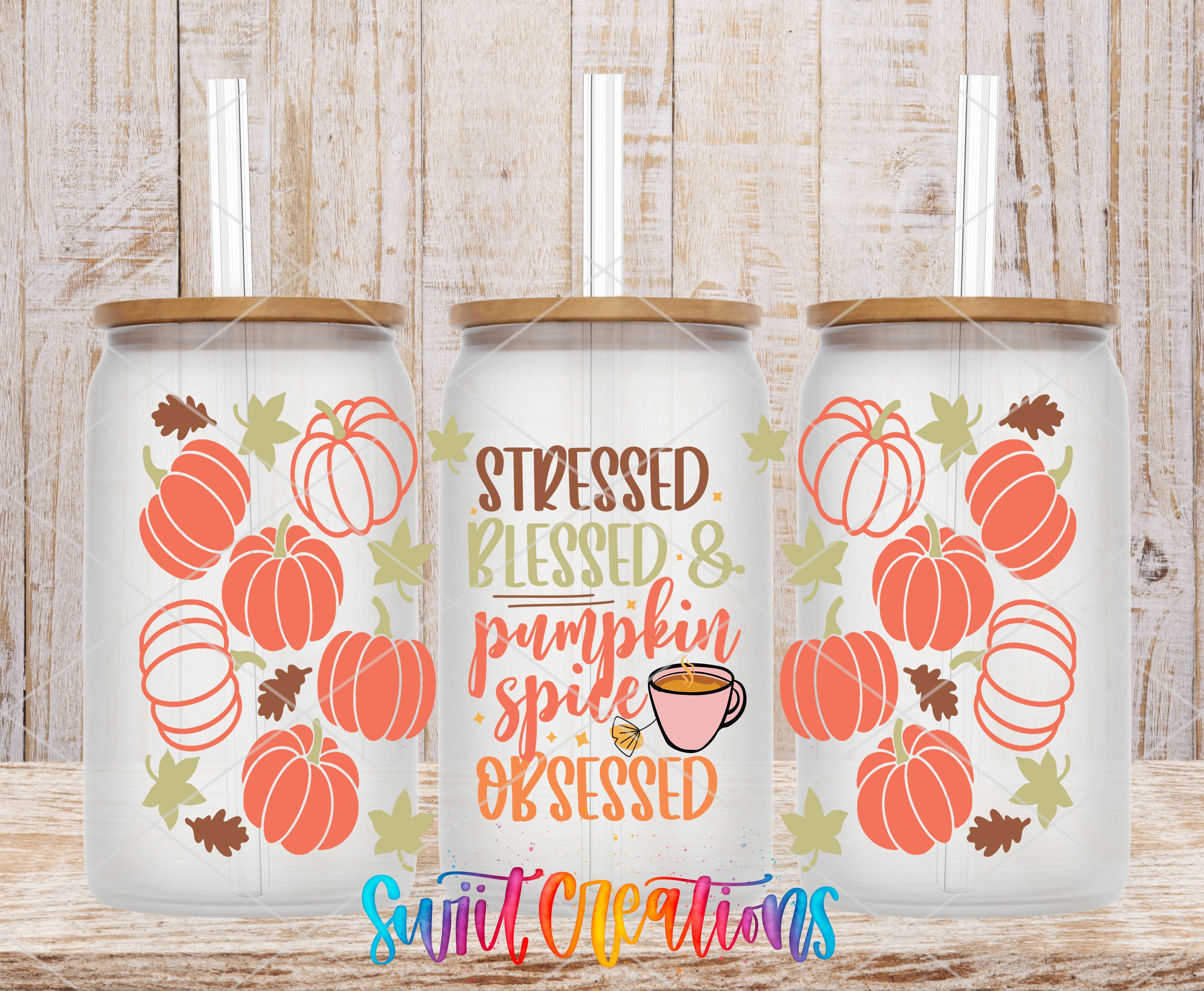 three glass tumblers with pumpkin and leaf designs, along with text that reads "Stressed, Blessed & Pumpkin Spiced Obsessed".