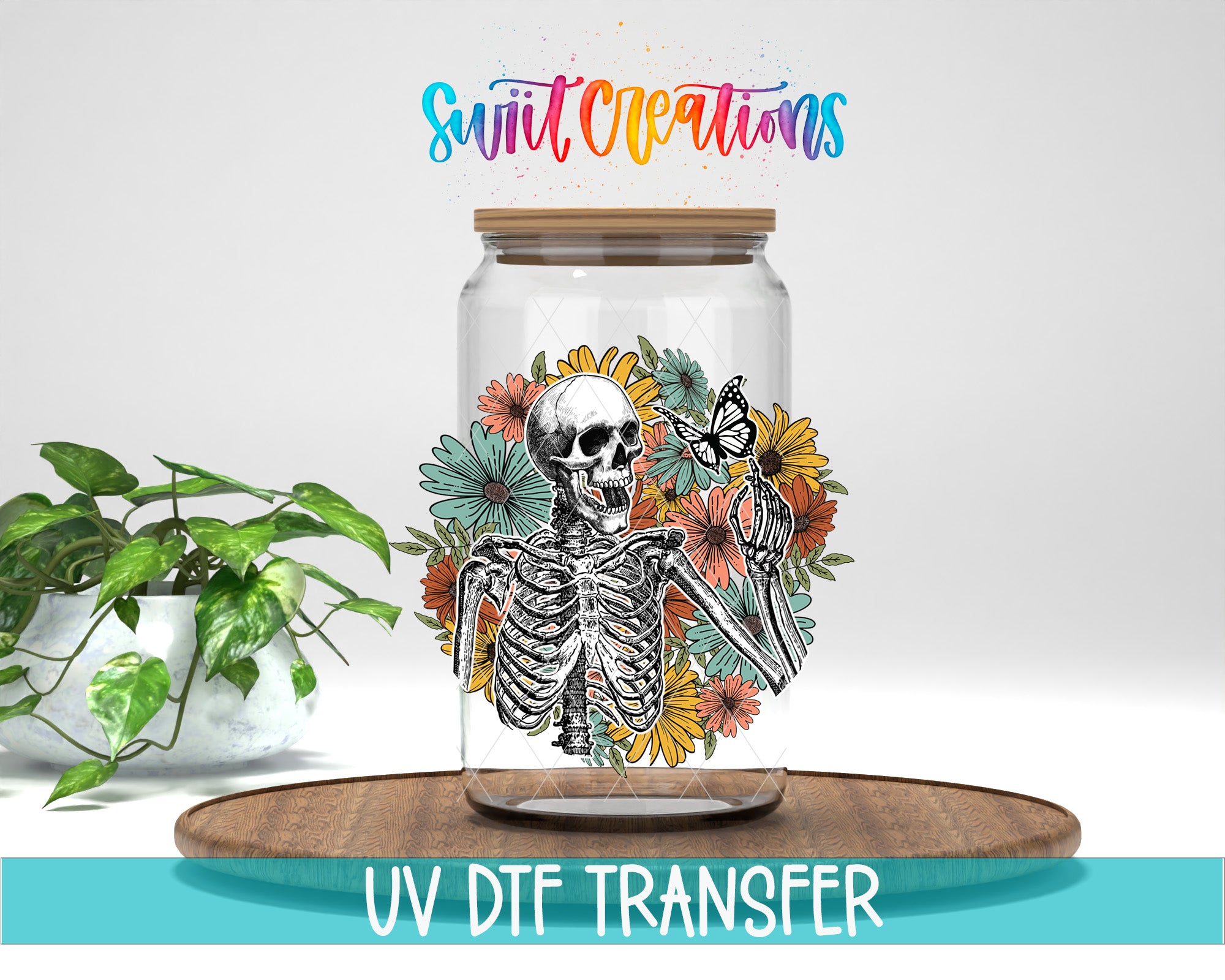 a glass jar with a skeleton and flowers, placed on a wooden surface.