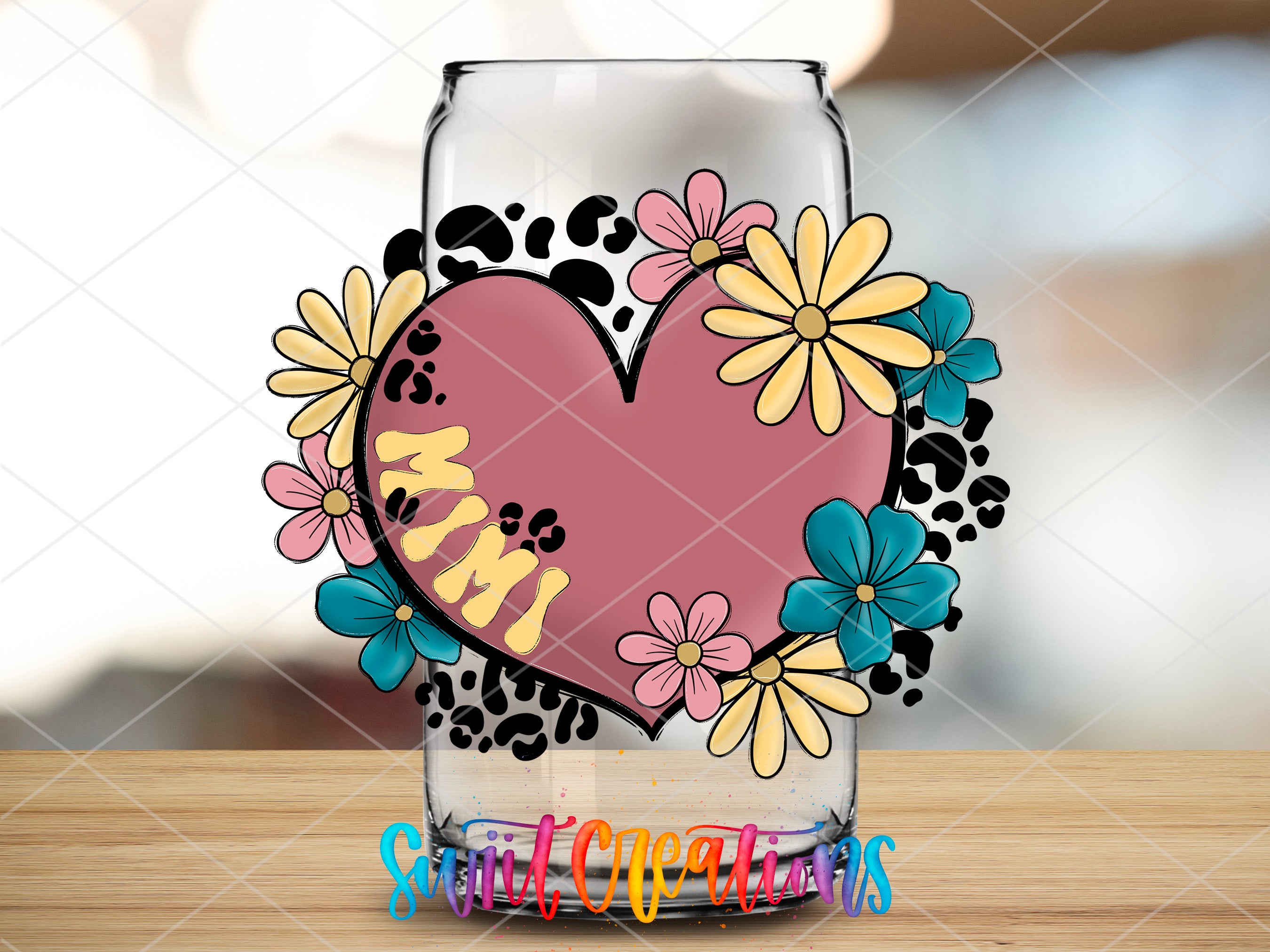 a glass with a heart and flowers on it