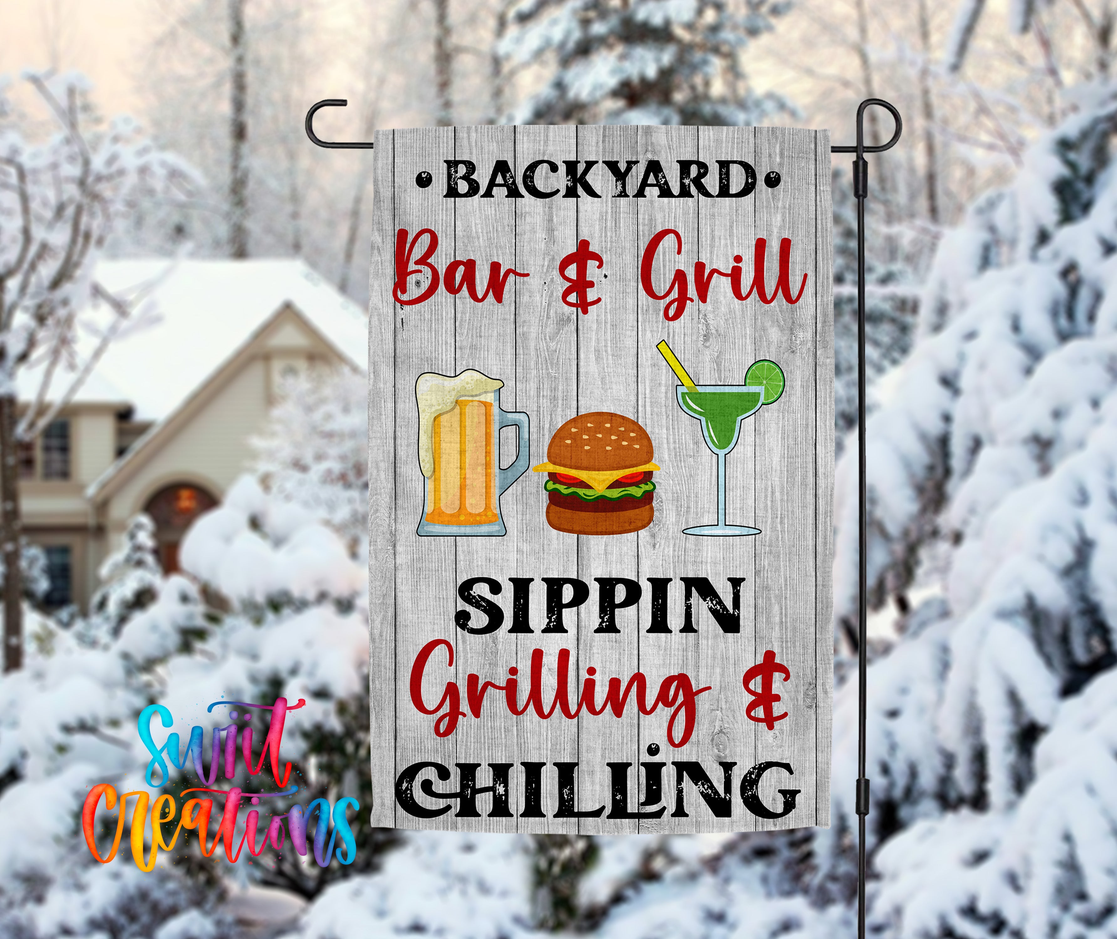 A wooden sign in the snow advertising a backyard bar and grill with a sipping and chilling theme.