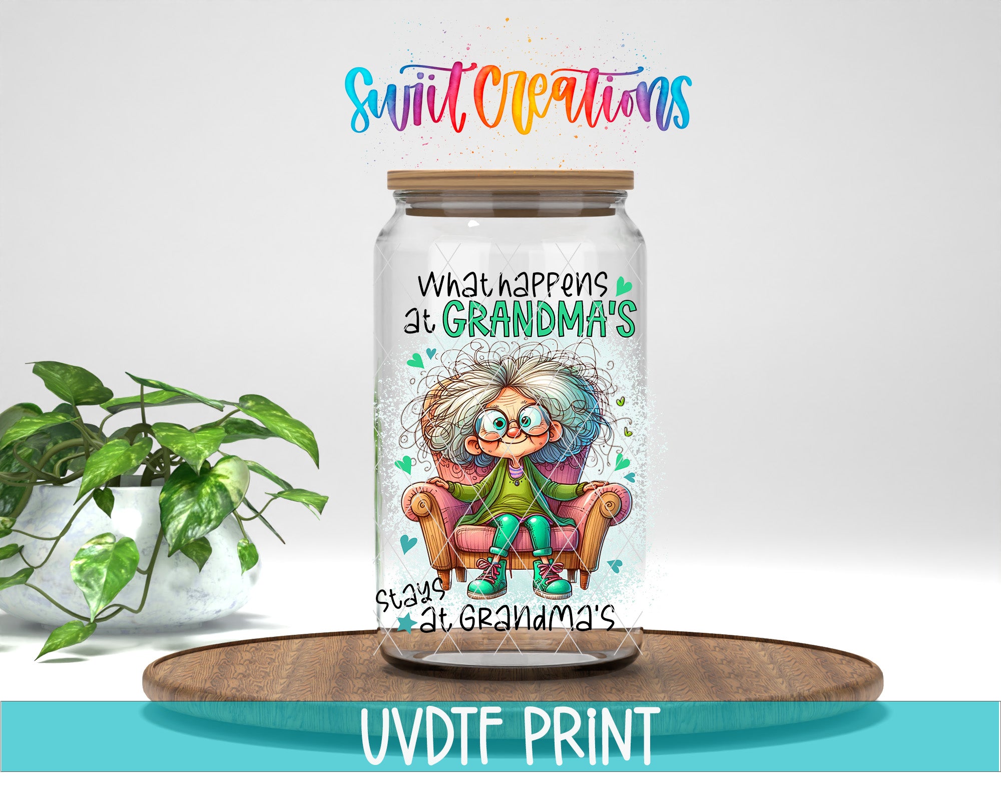 A glass jar with a colorful illustration of a person sitting in a chair, along with text that says "What happens at Grandma's". The jar is placed on a wooden surface, and there is a potted plant in the background.