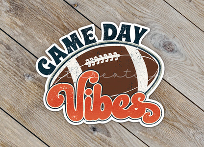 Close-up of the Football Game Day Vibes sticker on rustic wood