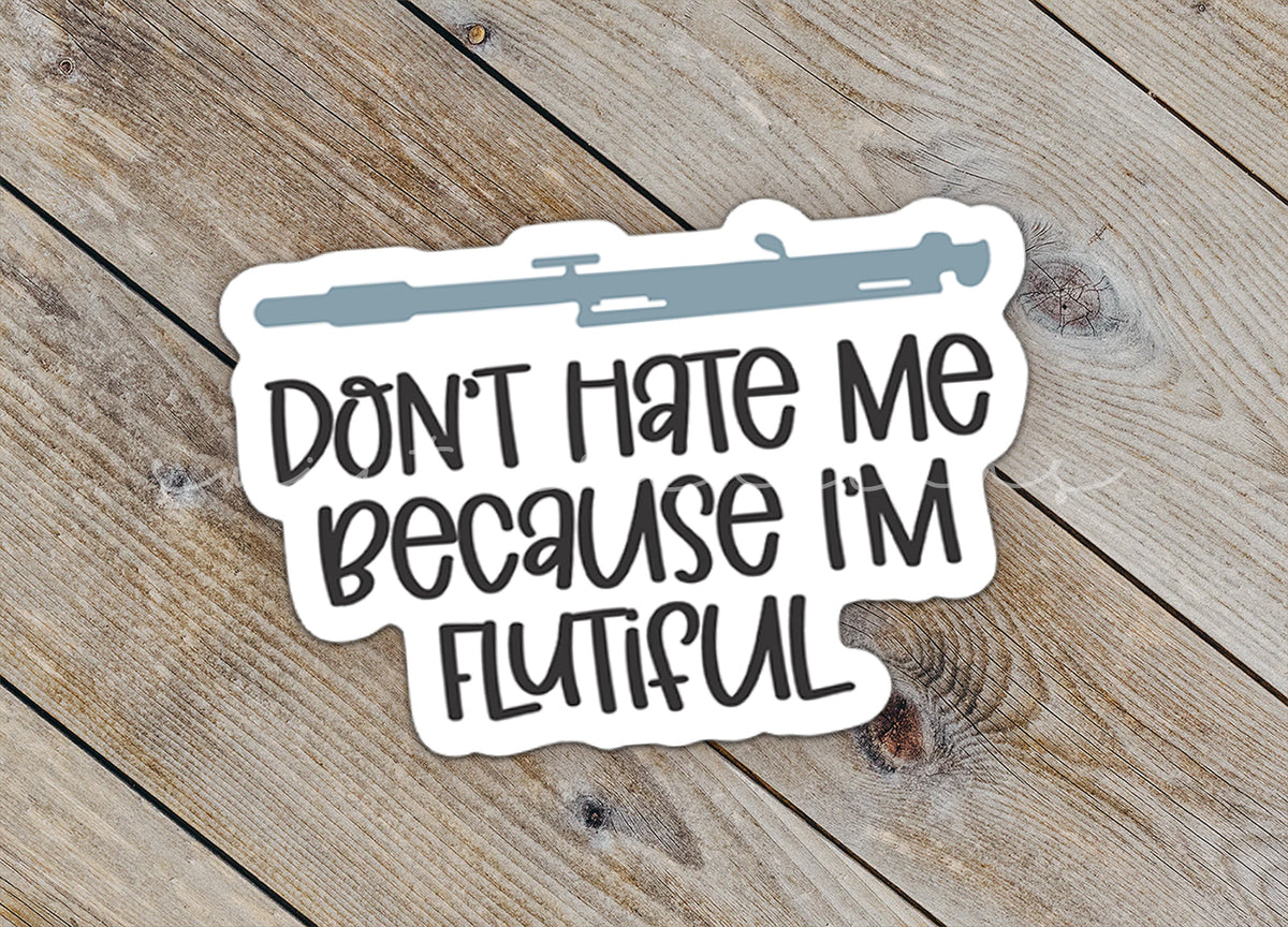 a sticker that says, don't hate me because i'm flu