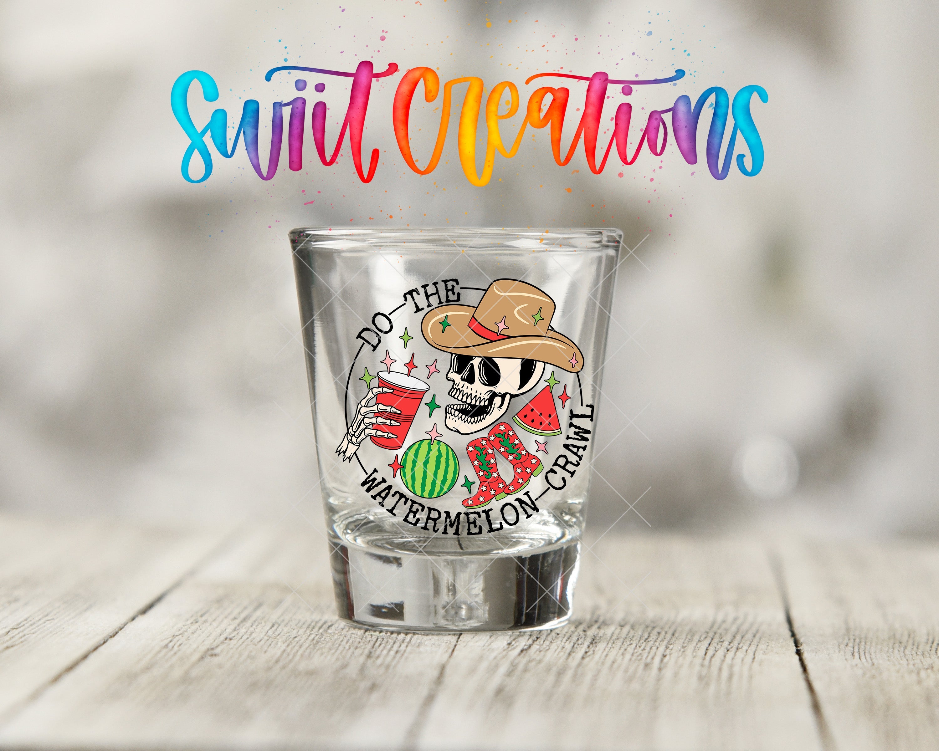 a shot glass with a mexican skull on it