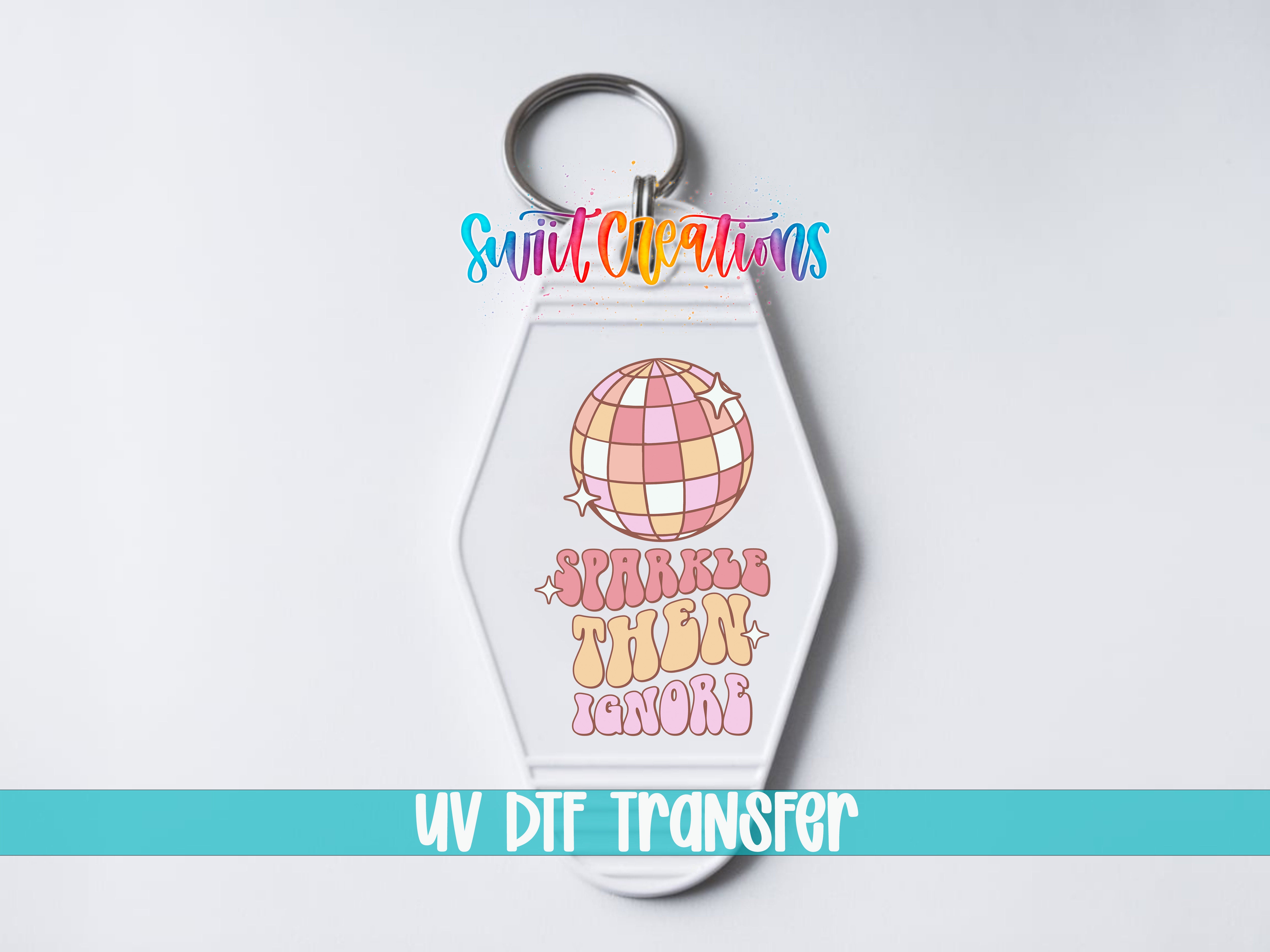 A keychain with a colorful design featuring a disco ball and the text "Sparkle then ignore" printed on it.