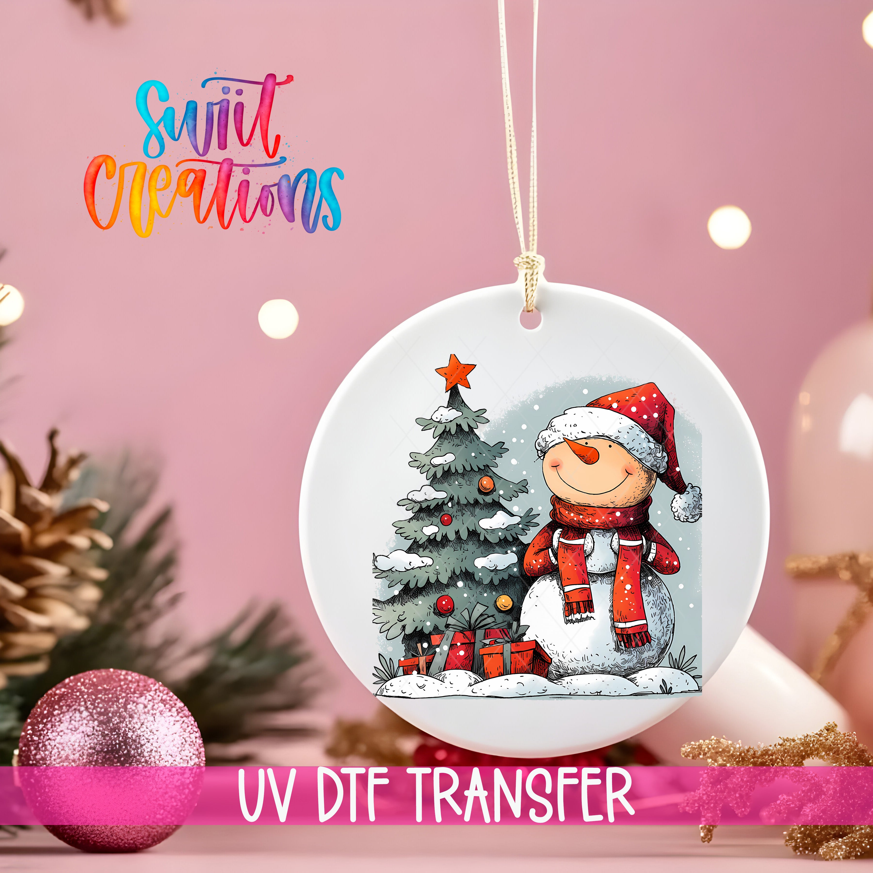 A white ceramic ornament with a snowman and Christmas tree design hangs against a pink background.