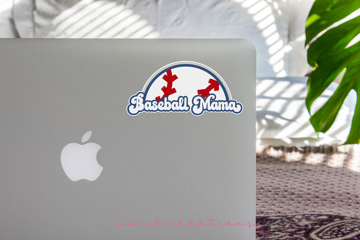 Baseball Mama sticker on the lid of a silver laptop