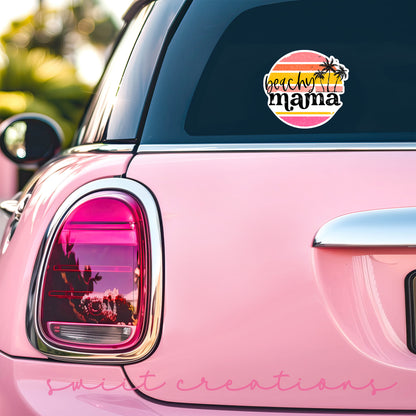Beachy Mama sticker on the back window of a pink car