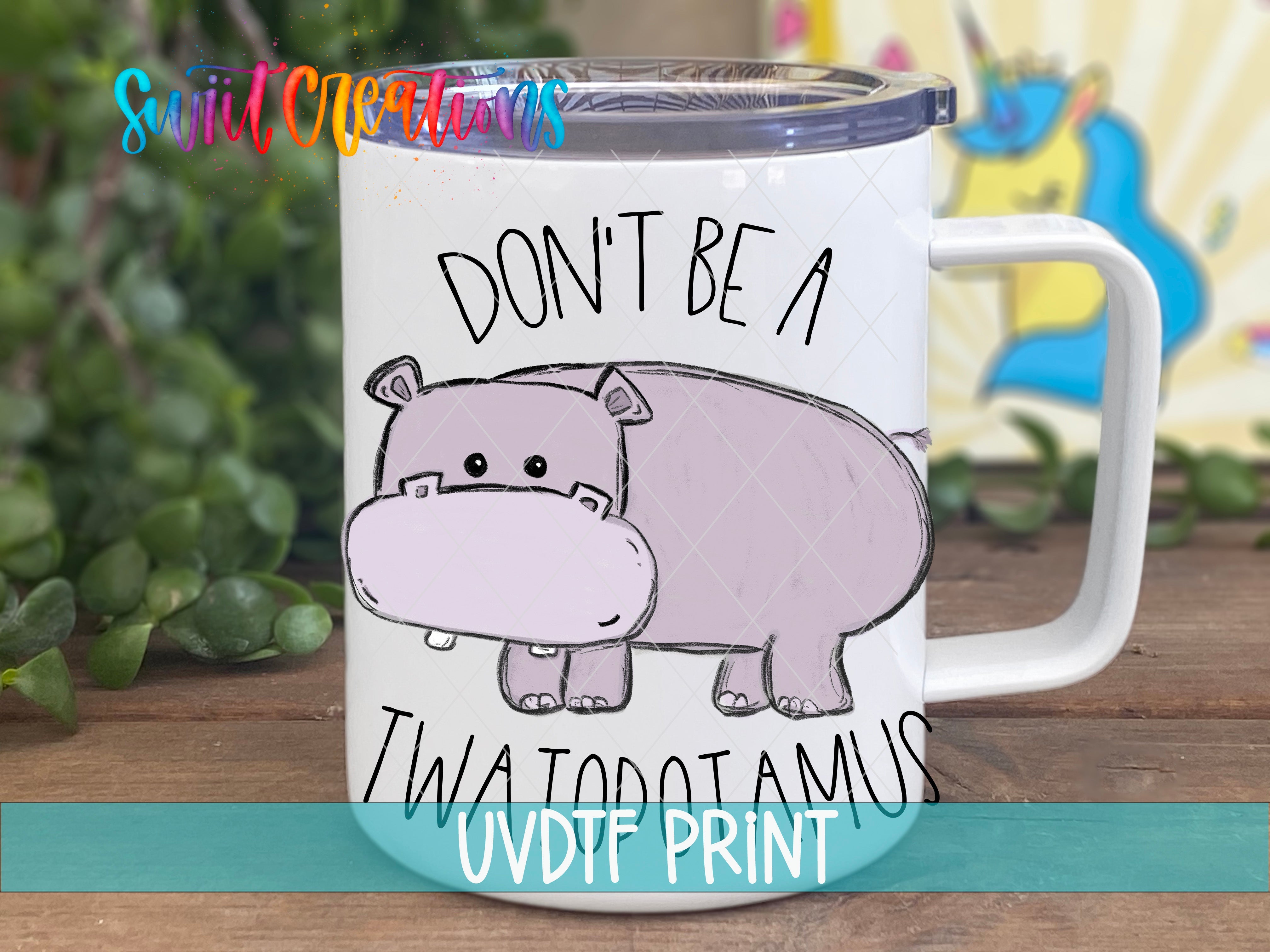 a coffee mug with a hippo on it that says don't be a