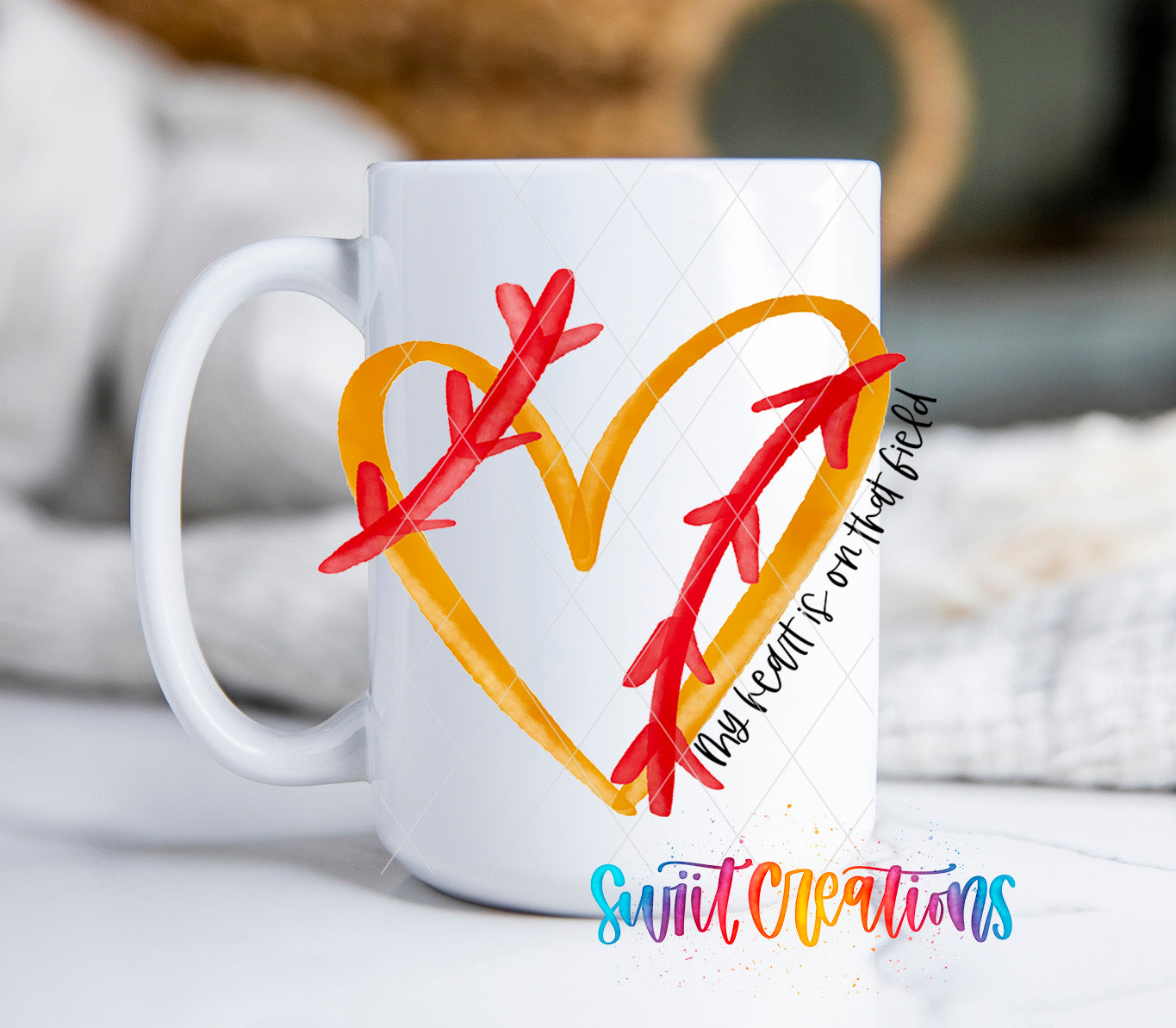 a white coffee mug with a heart and arrows painted on it