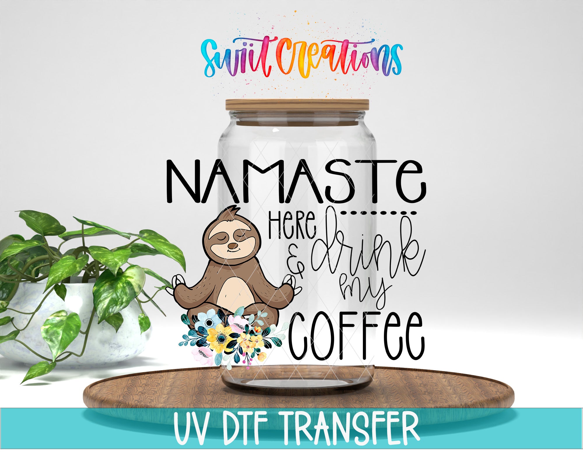 a sloth sitting inside a glass jar with the text "NAMASTE HERE... DRINK MY COFFEE" written on it. The jar is placed on a wooden surface, and there is a potted plant in the background.