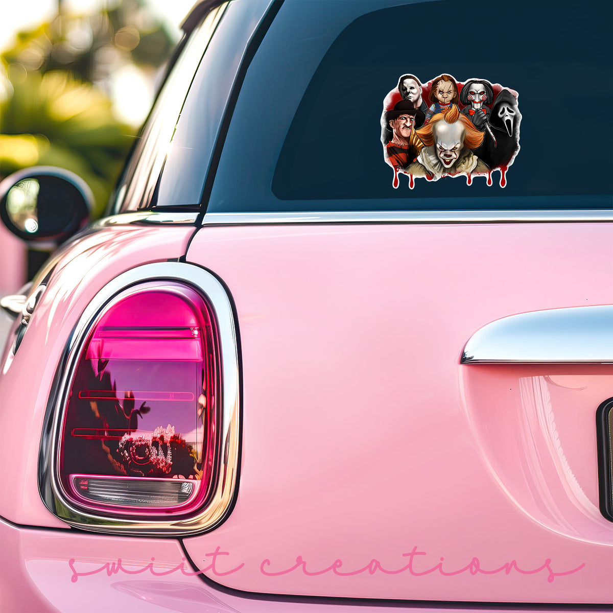 Horror Movie Villains sticker on the back window of a pink car