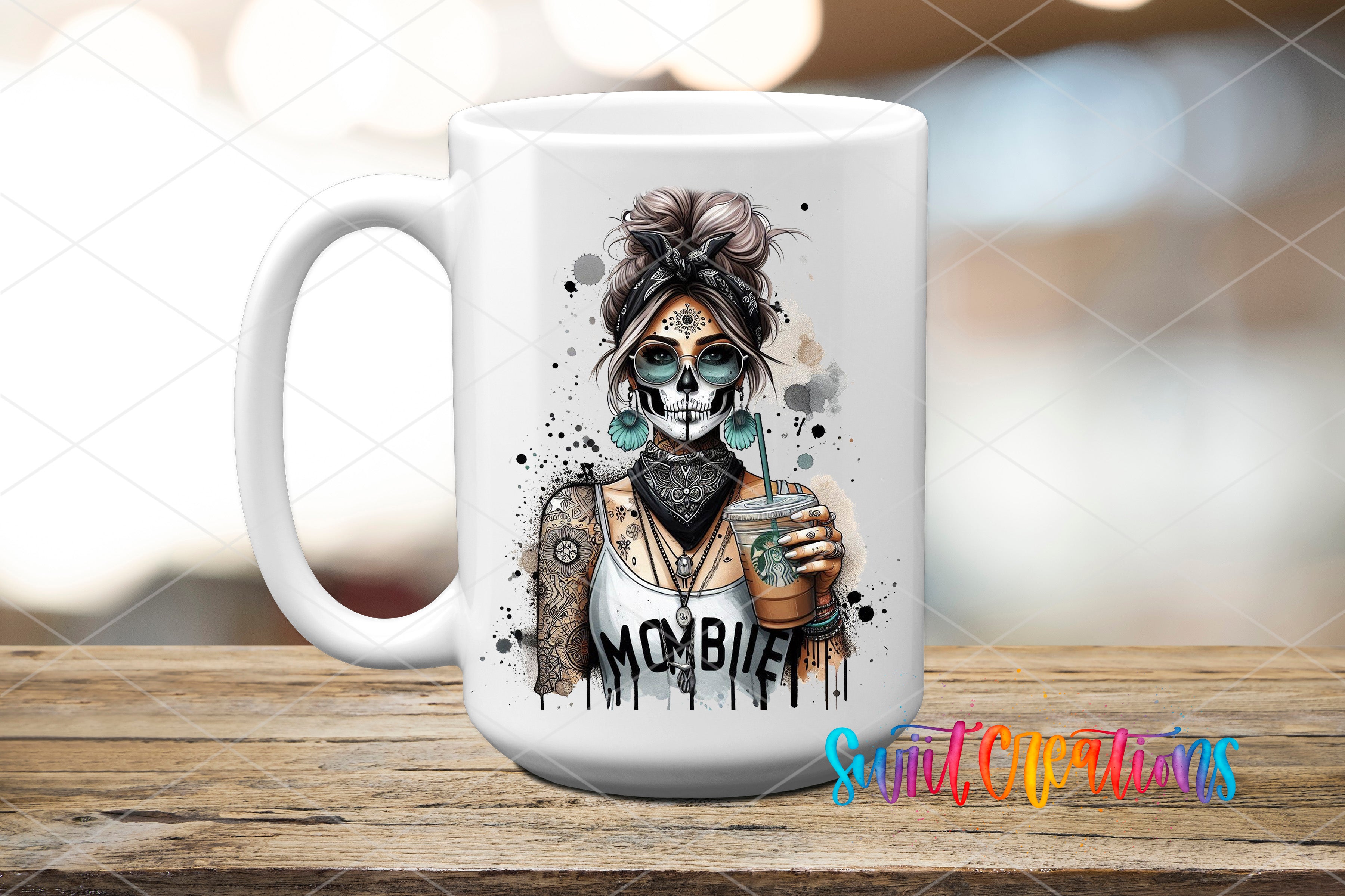 A white ceramic mug with a colorful and artistic design featuring a skull with a woman's face, holding a drink, and the word "MOMBIE" written on it.