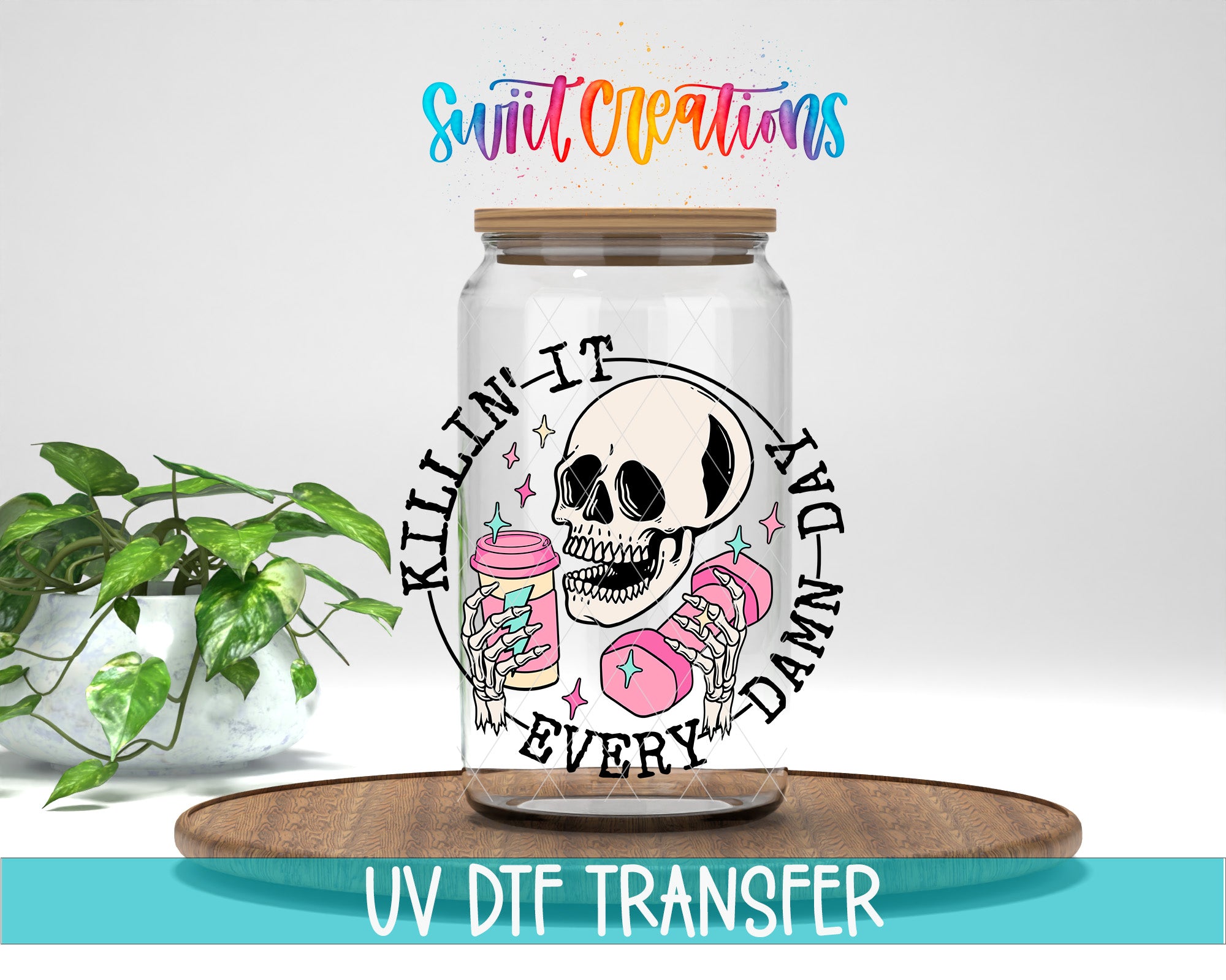 a glass jar with a skull design and text, placed on a wooden surface.