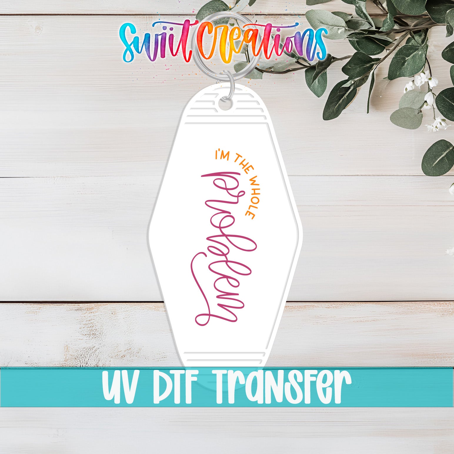 A keychain with the text "I'm the whole problem" printed on it, along with a UVDF (UV Dye Transfer) logo.