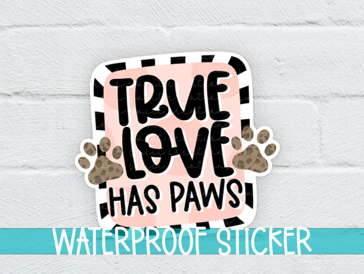 True Love Has Paws sticker on a white brick background with a waterproof sticker banner