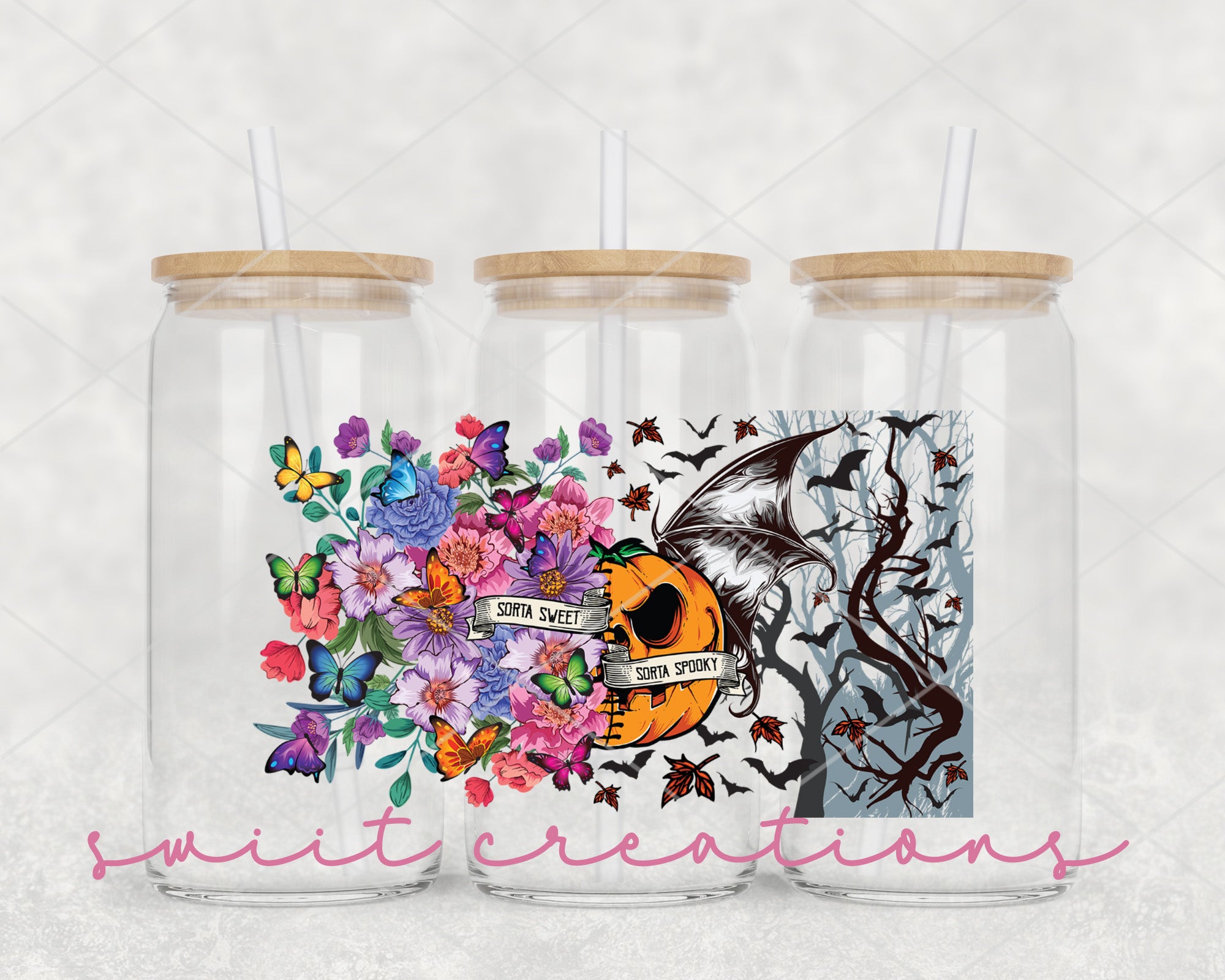a set of two tumblers with a picture of a skull and flowers on them