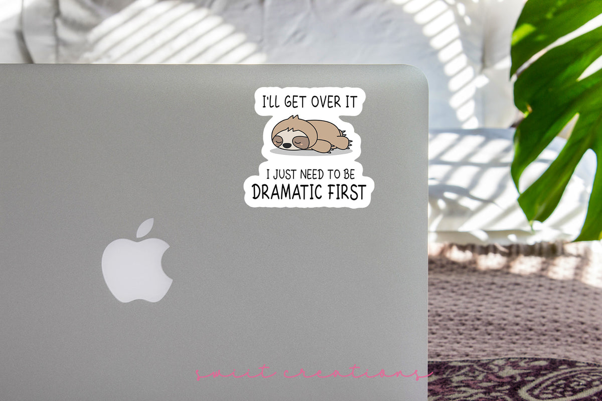 Dramatic Sloth sticker on the lid of a silver laptop