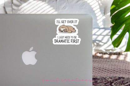 Dramatic Sloth sticker on the lid of a silver laptop