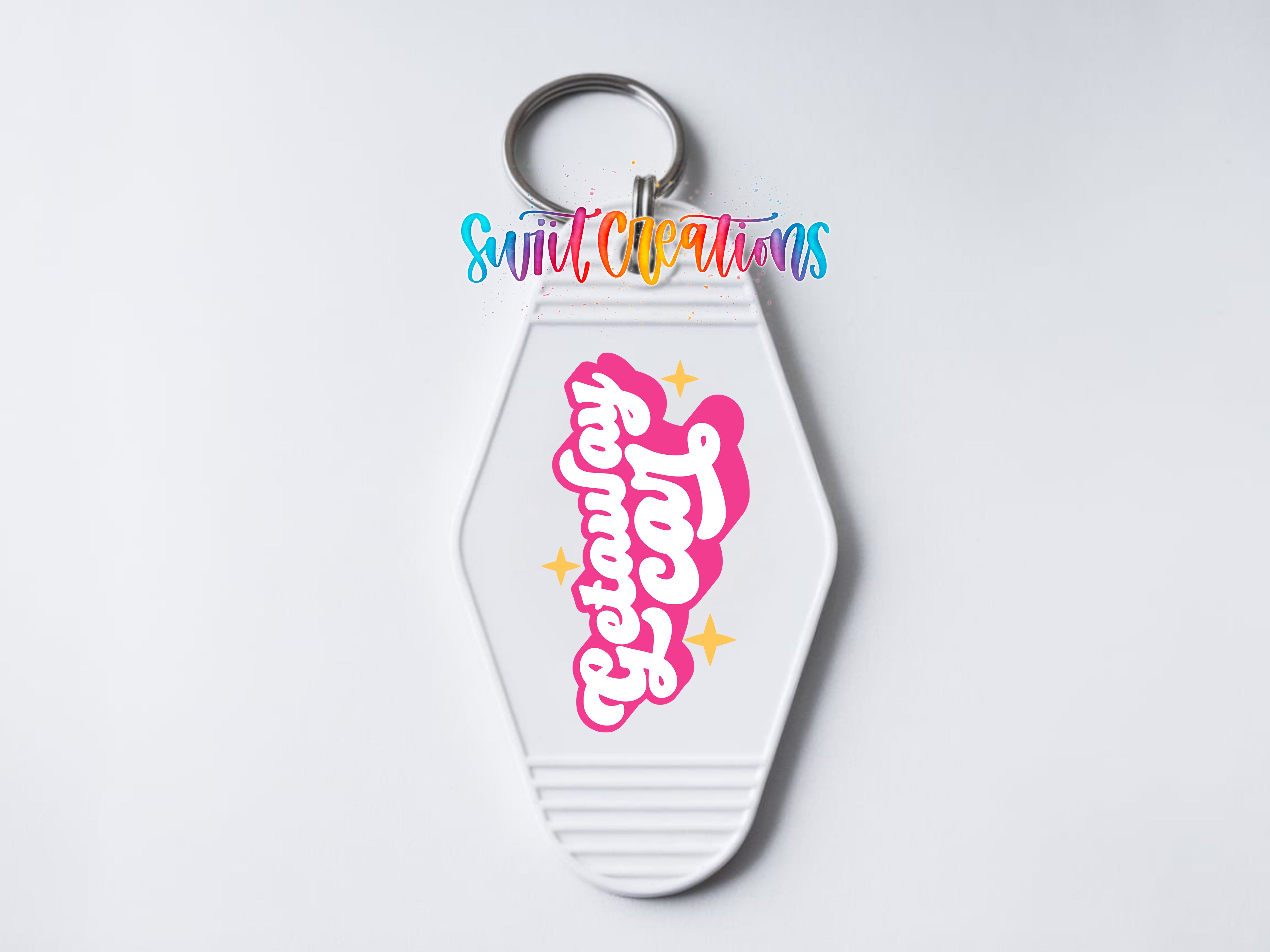 A keychain with a colorful, stylized logo and text on it.