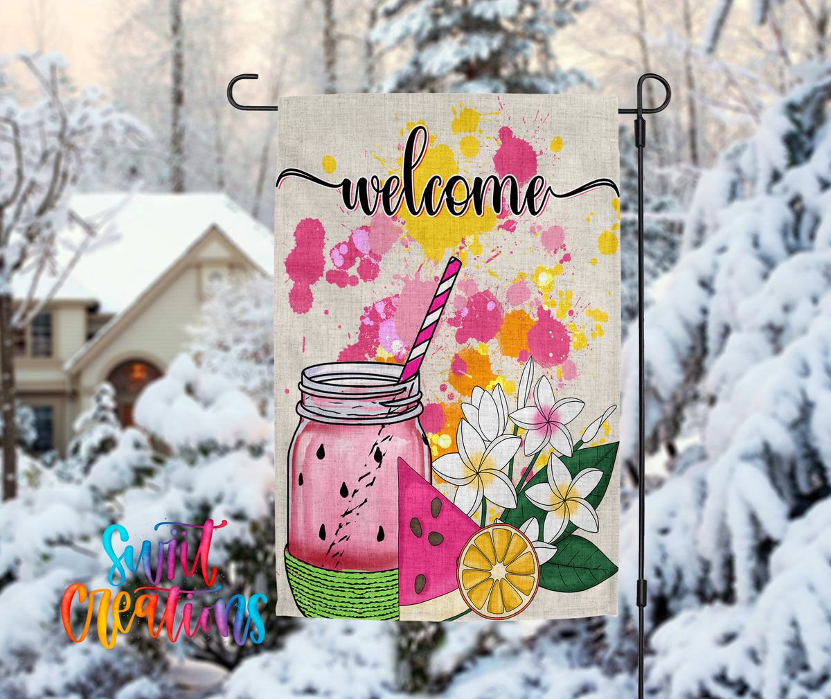 A colorful welcome sign with a mason jar and watermelon slices, set against a snowy background with a house and trees in the distance.
