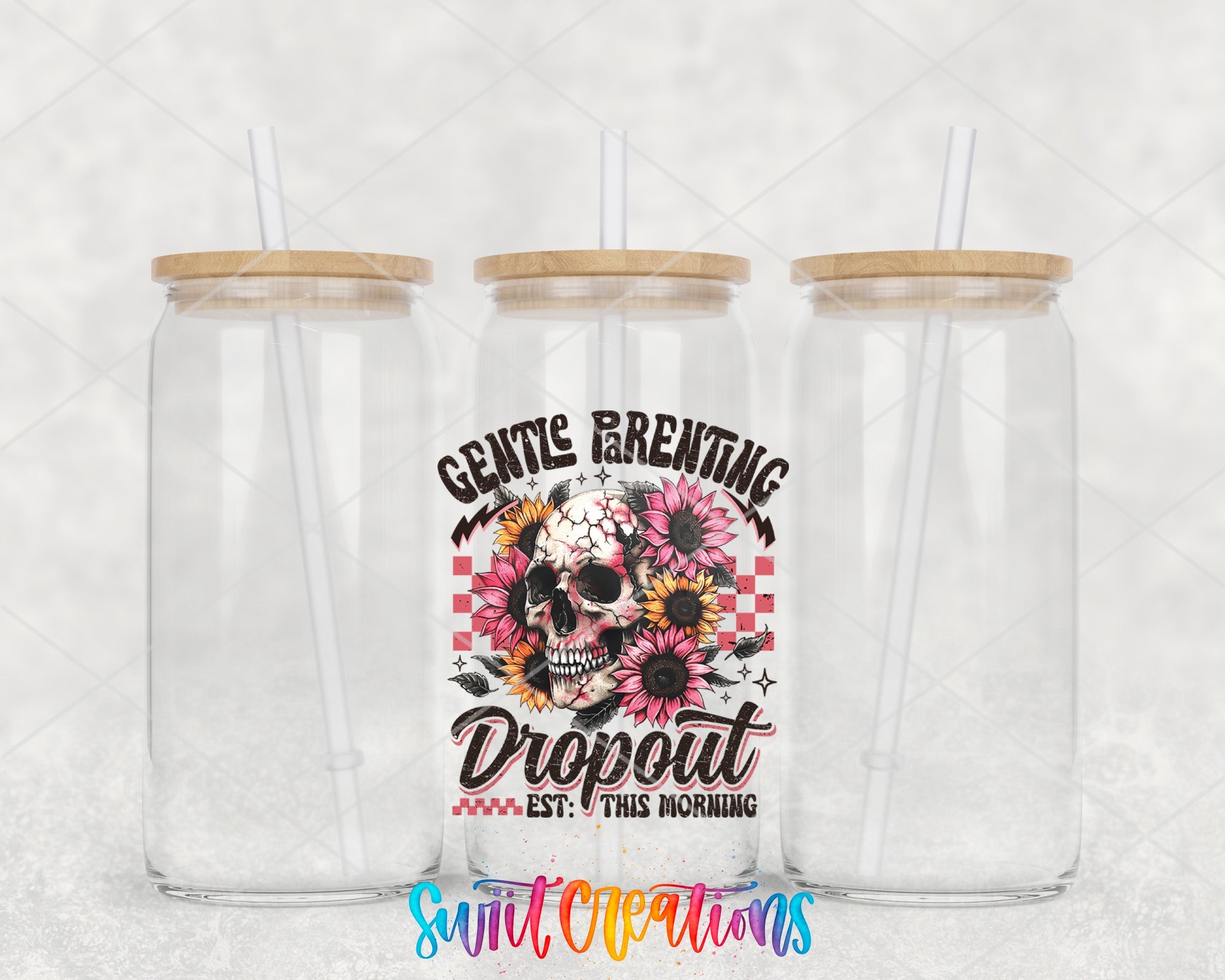 two clear tumblers with a skull and flowers on them