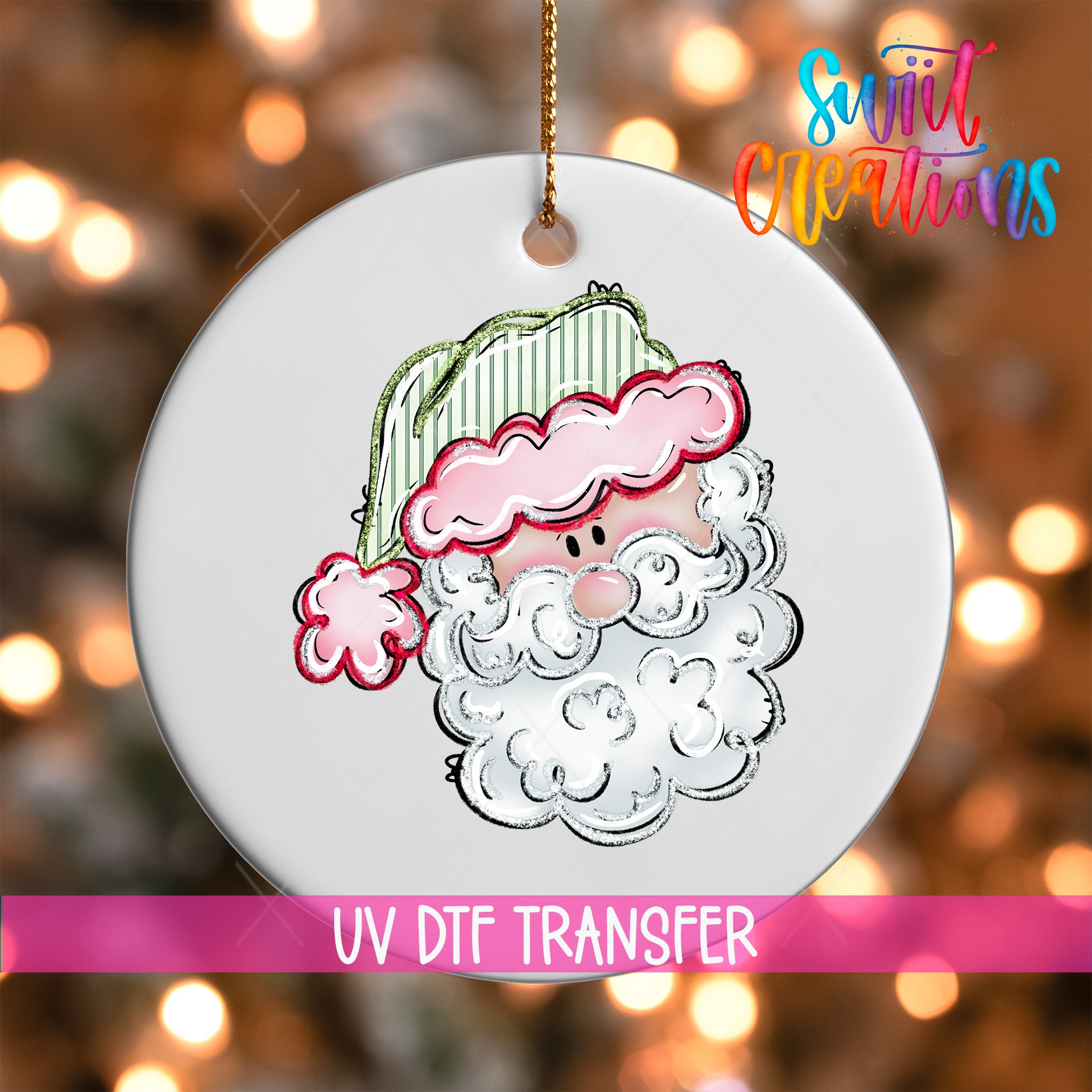 A white ornament with a Santa Claus face design, hanging against a background of colorful lights.