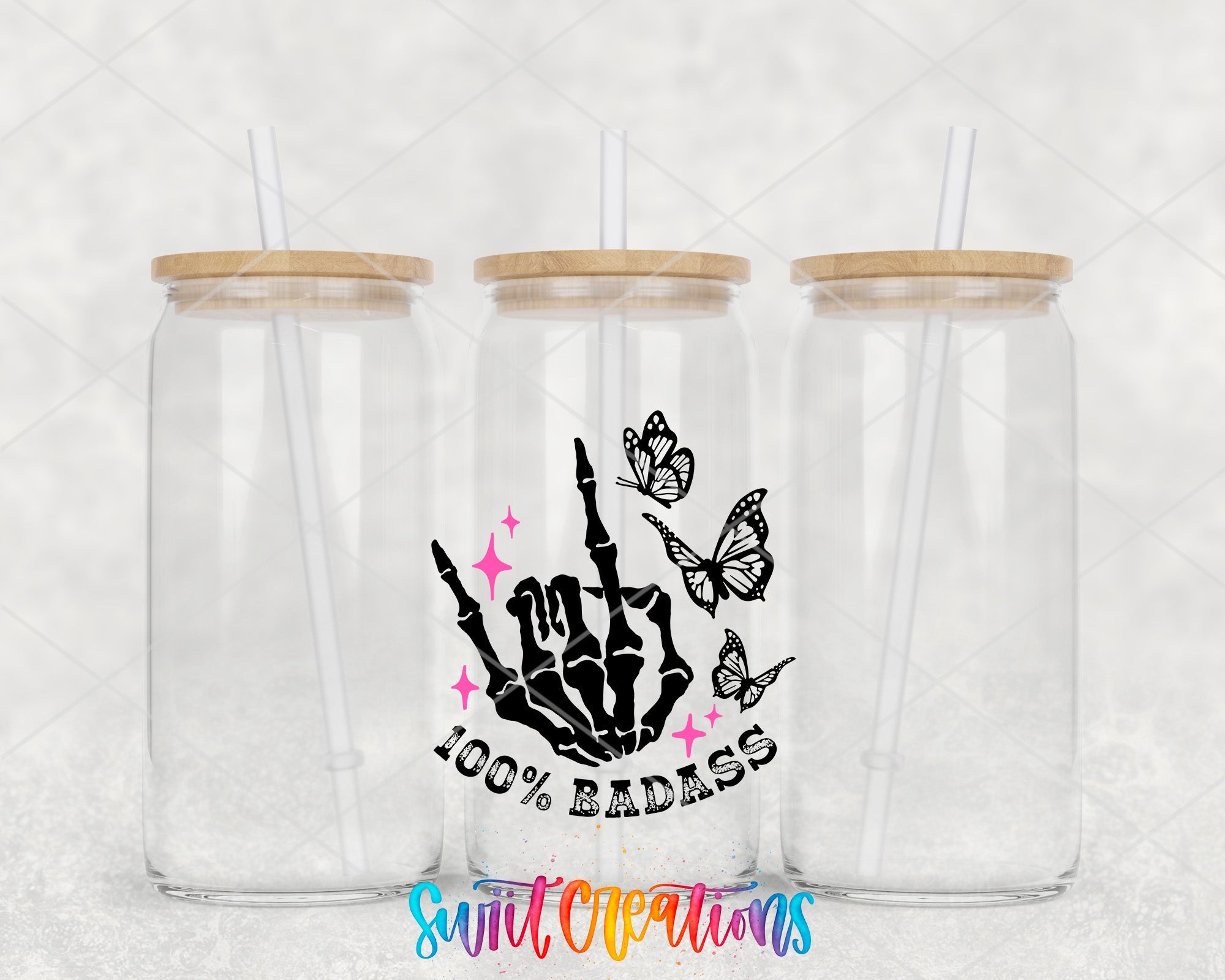 two clear tumblers with wooden lids and a sticker of a hand holding a