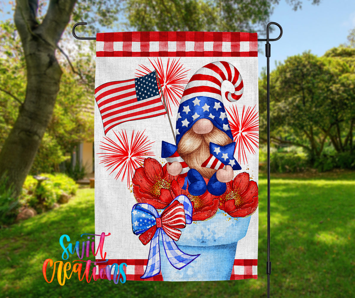 A patriotic flag featuring a gnome holding an American flag and red and white flowers, with a red and white checkered border and a blue and white bow.