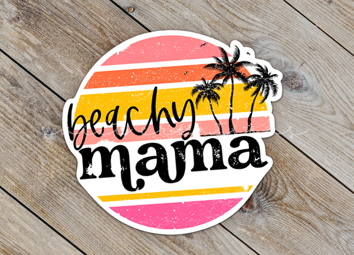Close-up of the Beachy Mama sticker on rustic wood