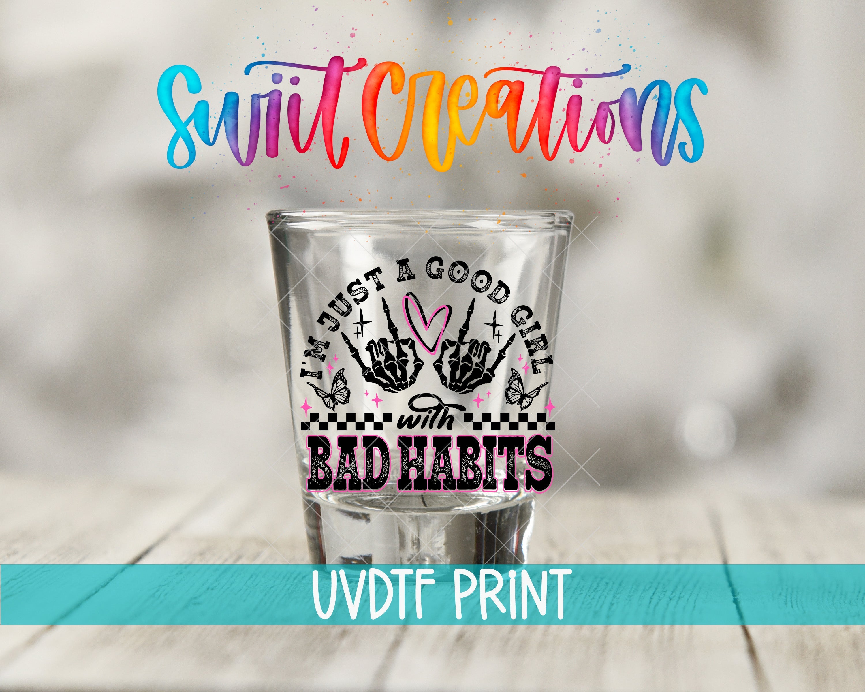 a shot glass sitting on top of a wooden table