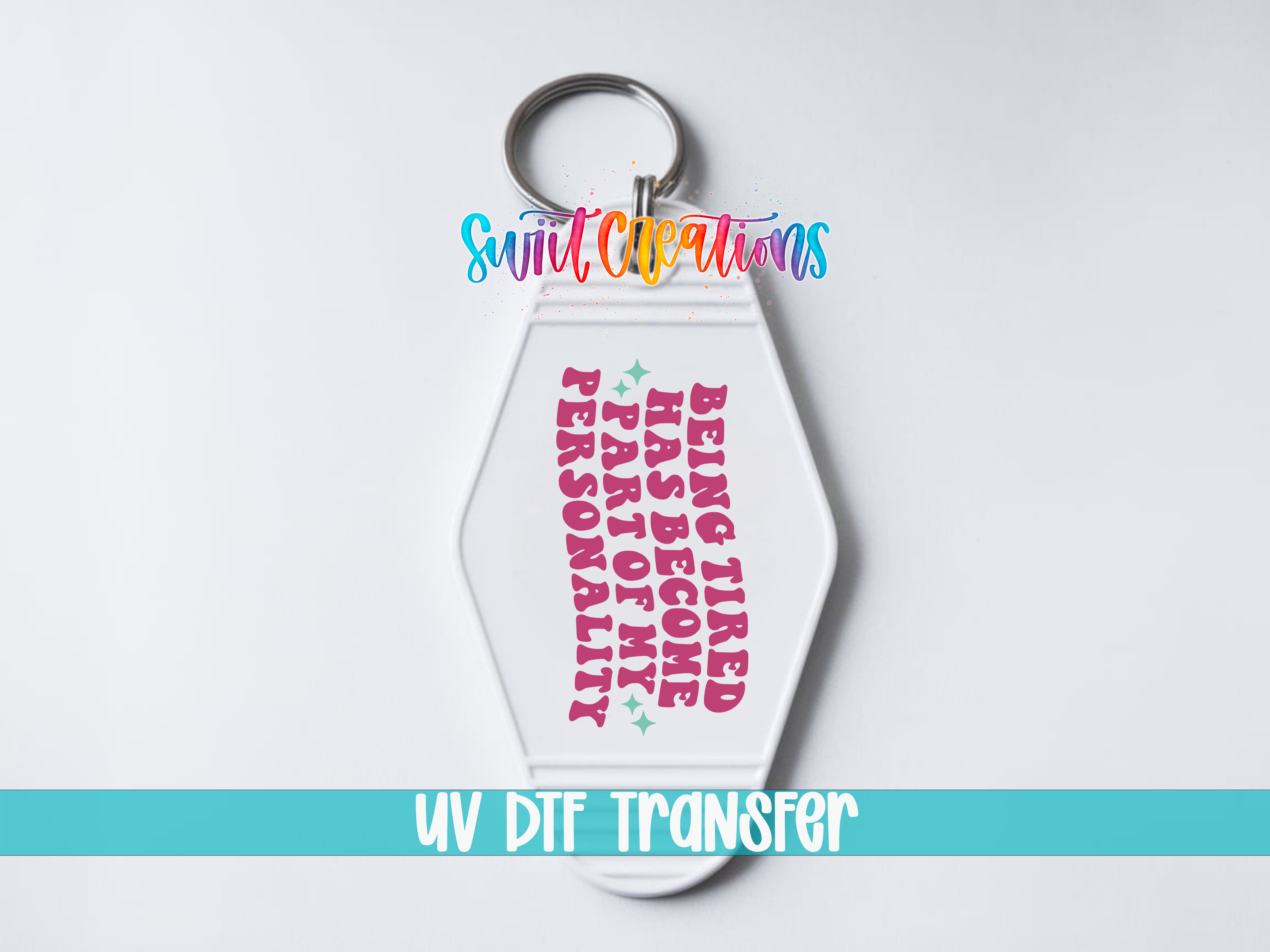 A keychain with a message printed on it, which says "Being Tired Has Become Part of My Personality".
