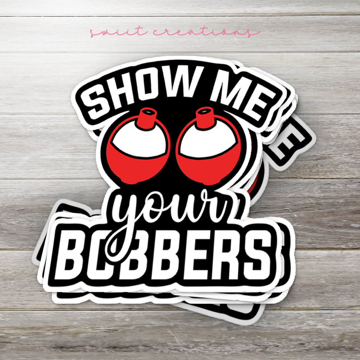 Stack of Show Me Your Bobbers glossy stickers on a gray wood table