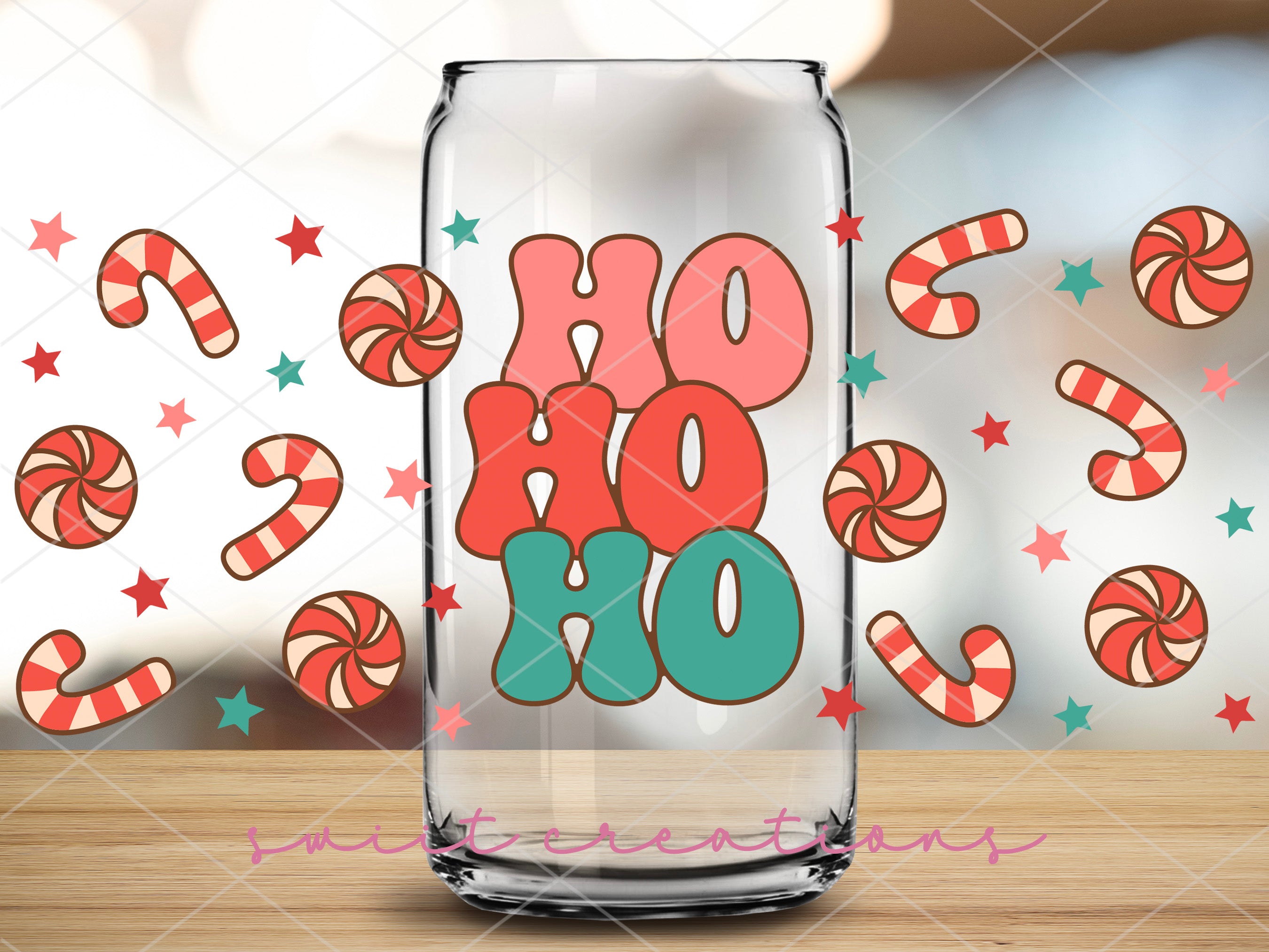 a glass jar with a candy cane design on it