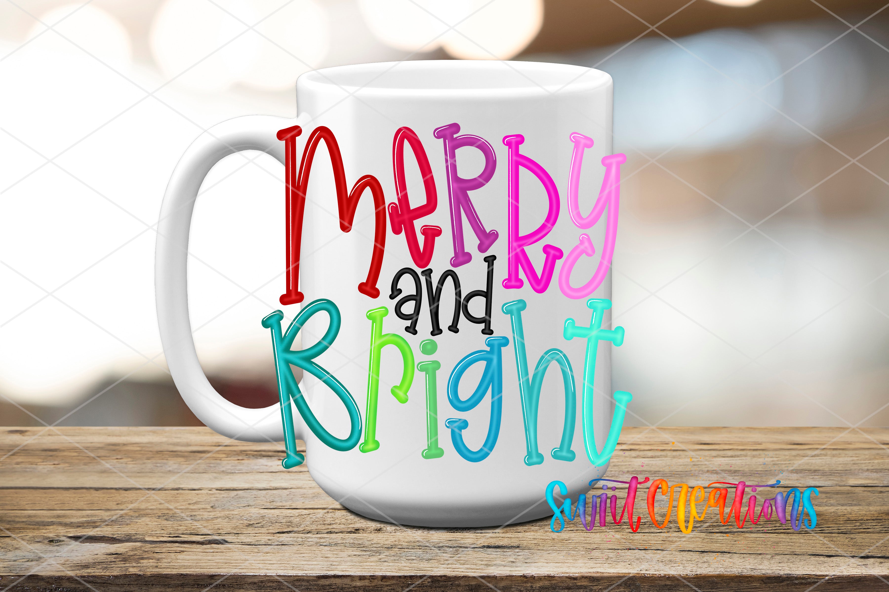 A white mug with colorful text that says "Merry and Bright" on it, placed on a wooden surface.