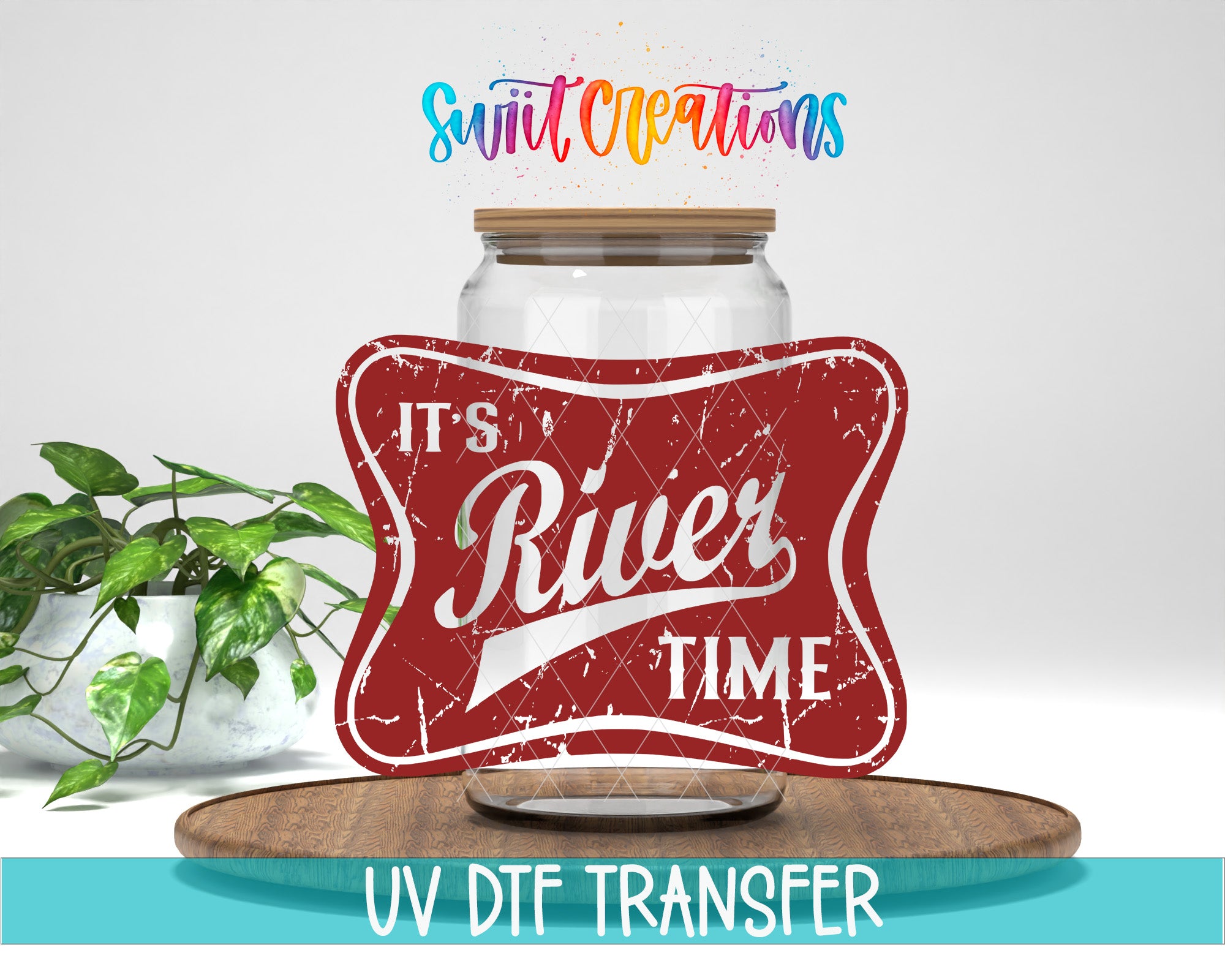 a red vintage-style sign with the text "It's River Time" and a wooden tray with a plant on it. The sign is placed on a wooden surface, and there is a plant in the background.