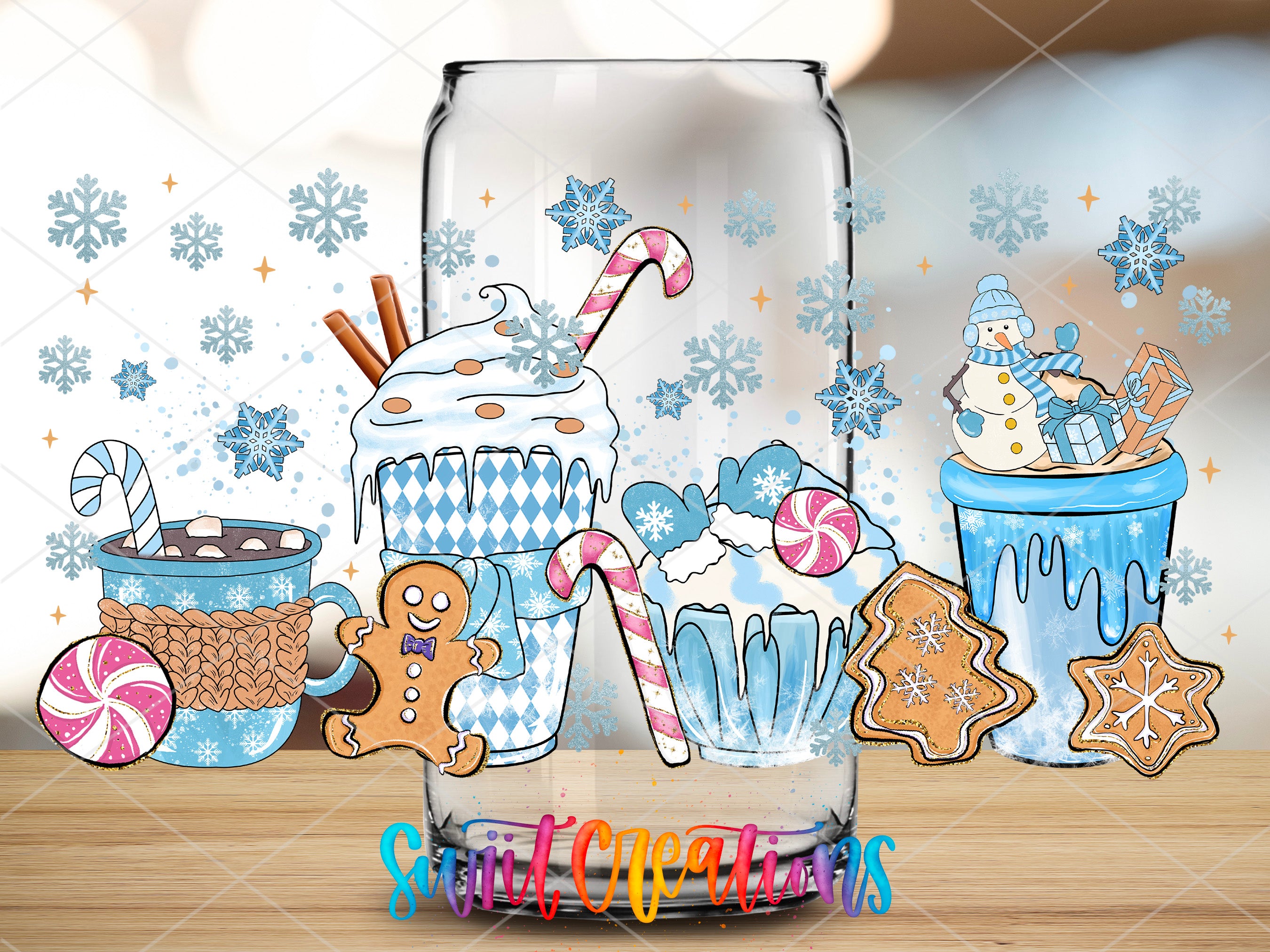 a glass with a picture of some cupcakes and gingerbreads