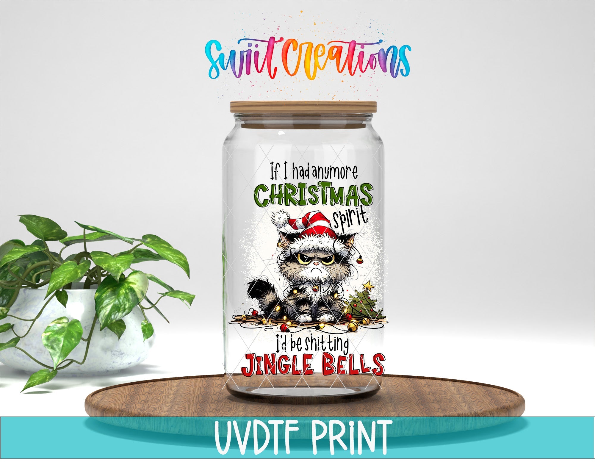 a glass jar with a christmas design on it