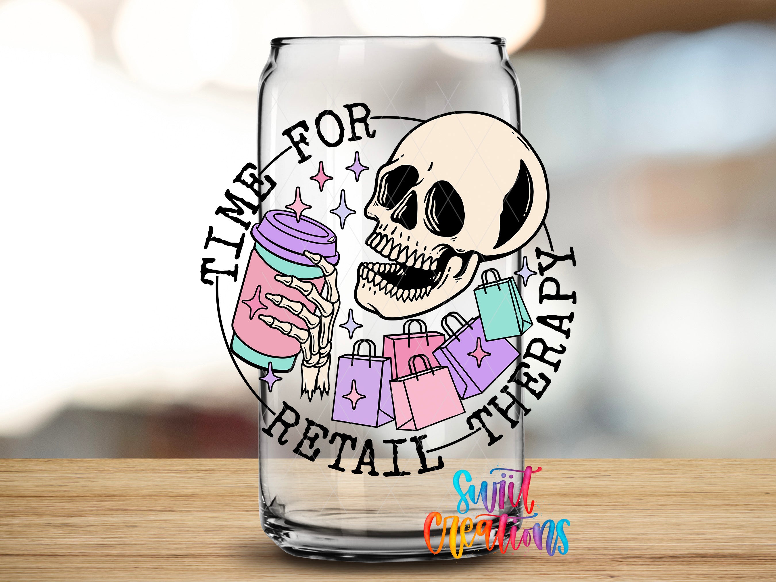 A glass can with a skull and shopping bags, along with the text "Time for Retail Therapy" and "Suitcase Creations" printed on it.
