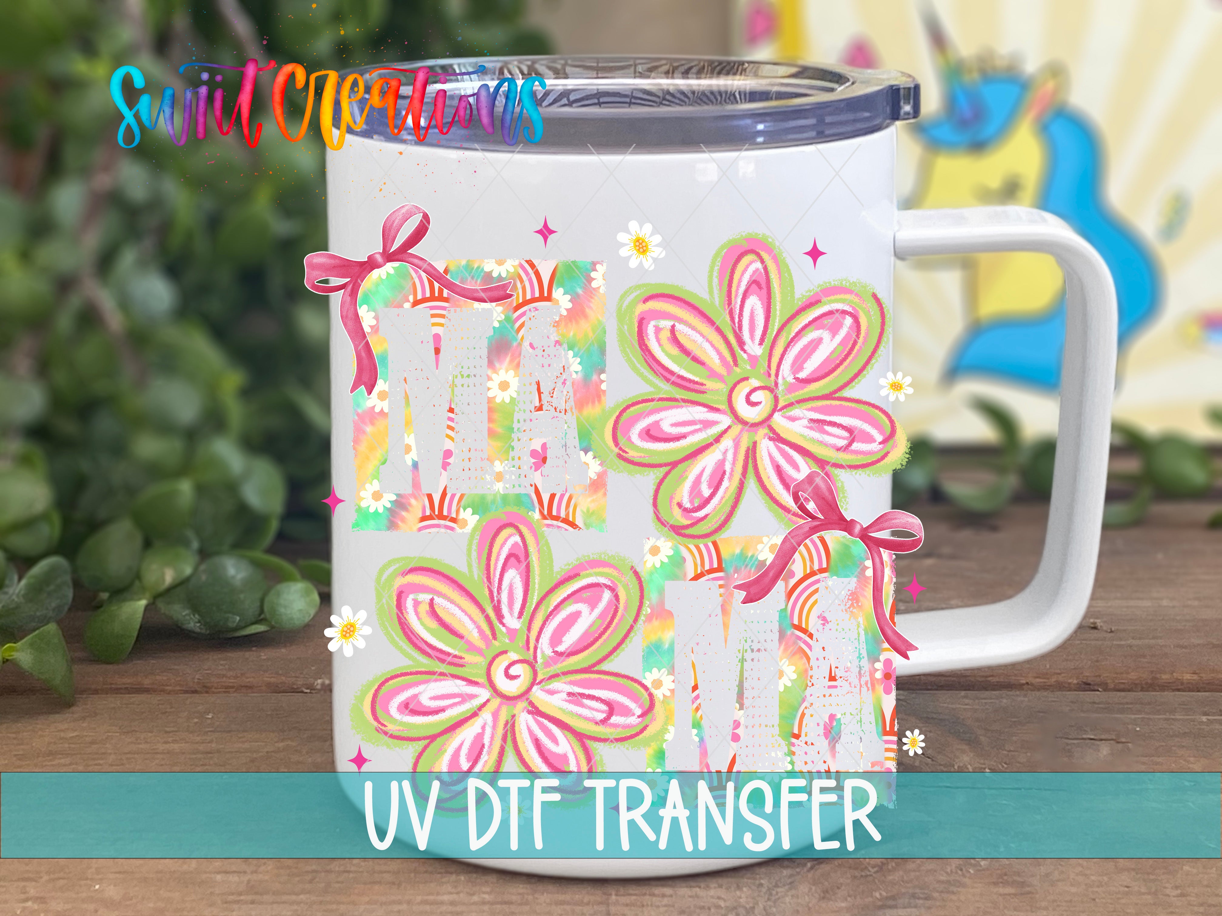 A white ceramic mug with colorful floral designs and a clear lid, placed on a wooden surface.