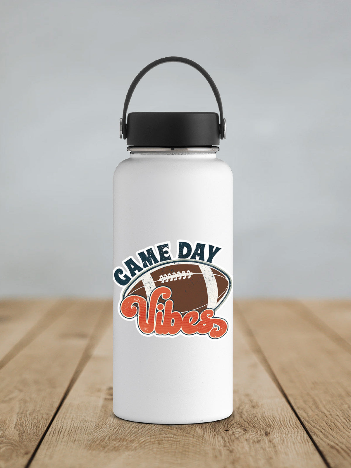 Football Game Day Vibes sticker on a white insulated water bottle