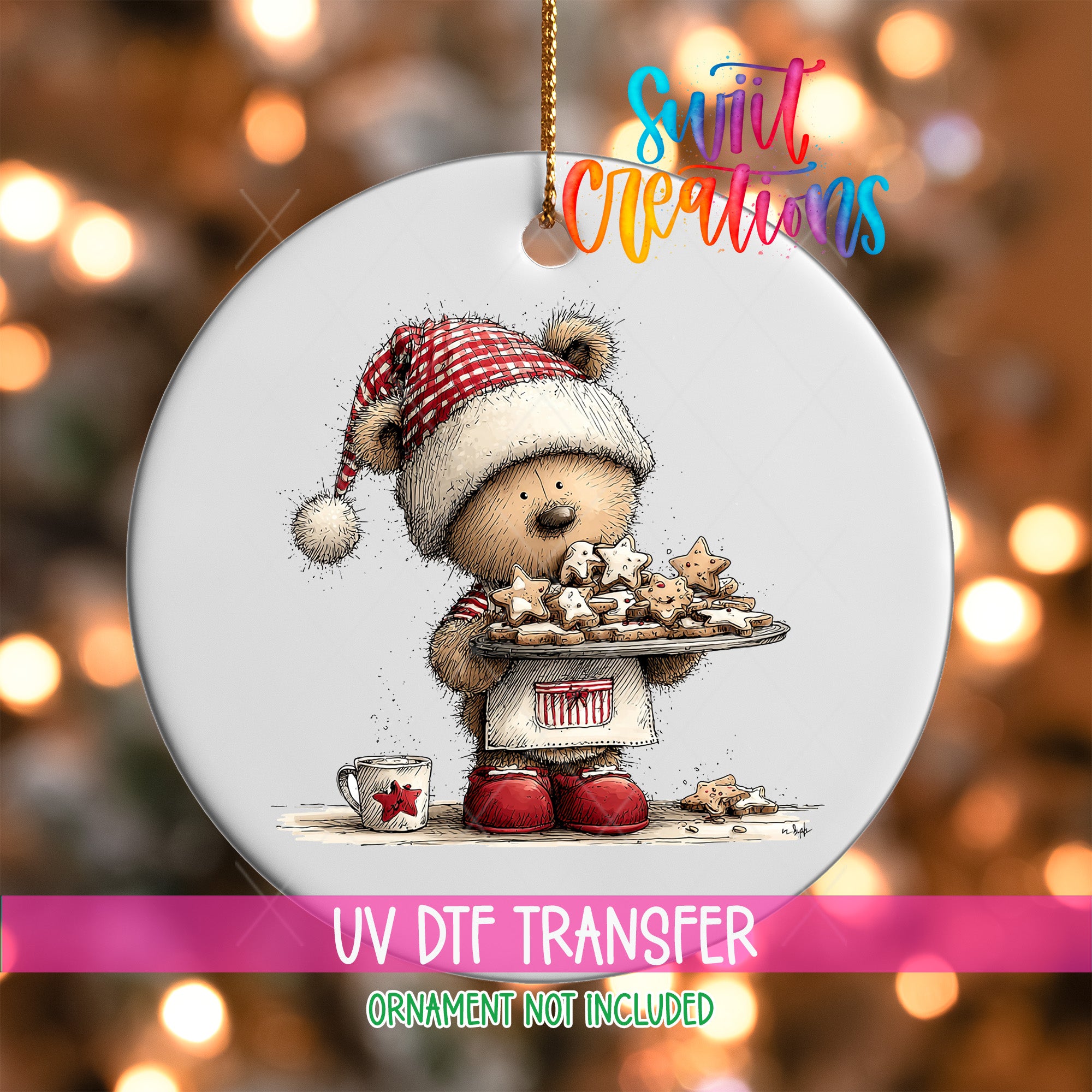 A white ornament featuring a teddy bear wearing a Santa hat and holding a tray of cookies, with a background of Christmas lights.