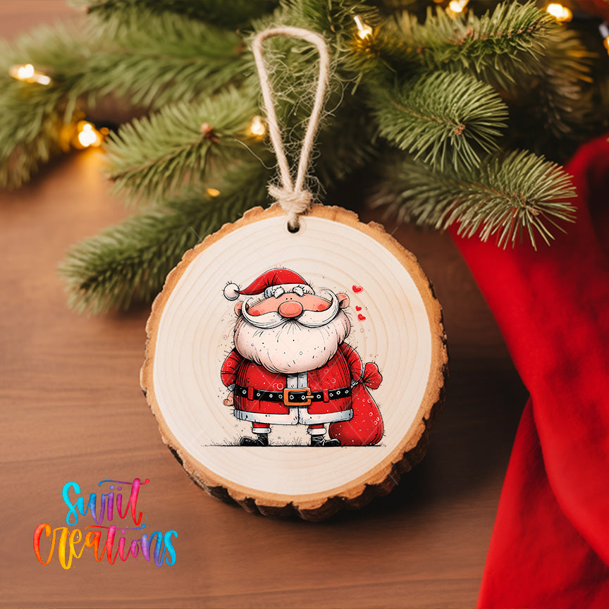 A wooden ornament featuring a cartoon Santa Claus figure is hanging on a Christmas tree, with a red cloth visible in the background.