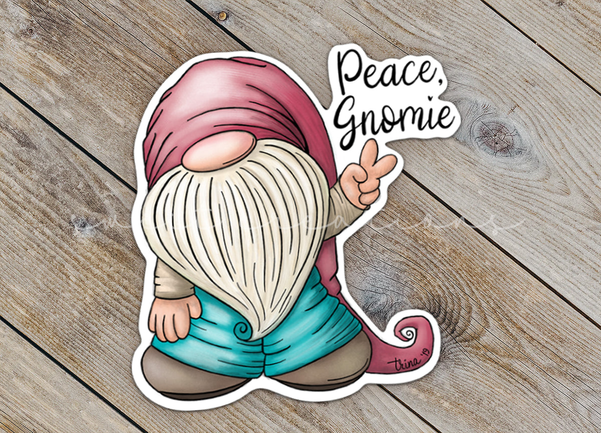 Close-up of the Peace Gnomie sticker on rustic wood