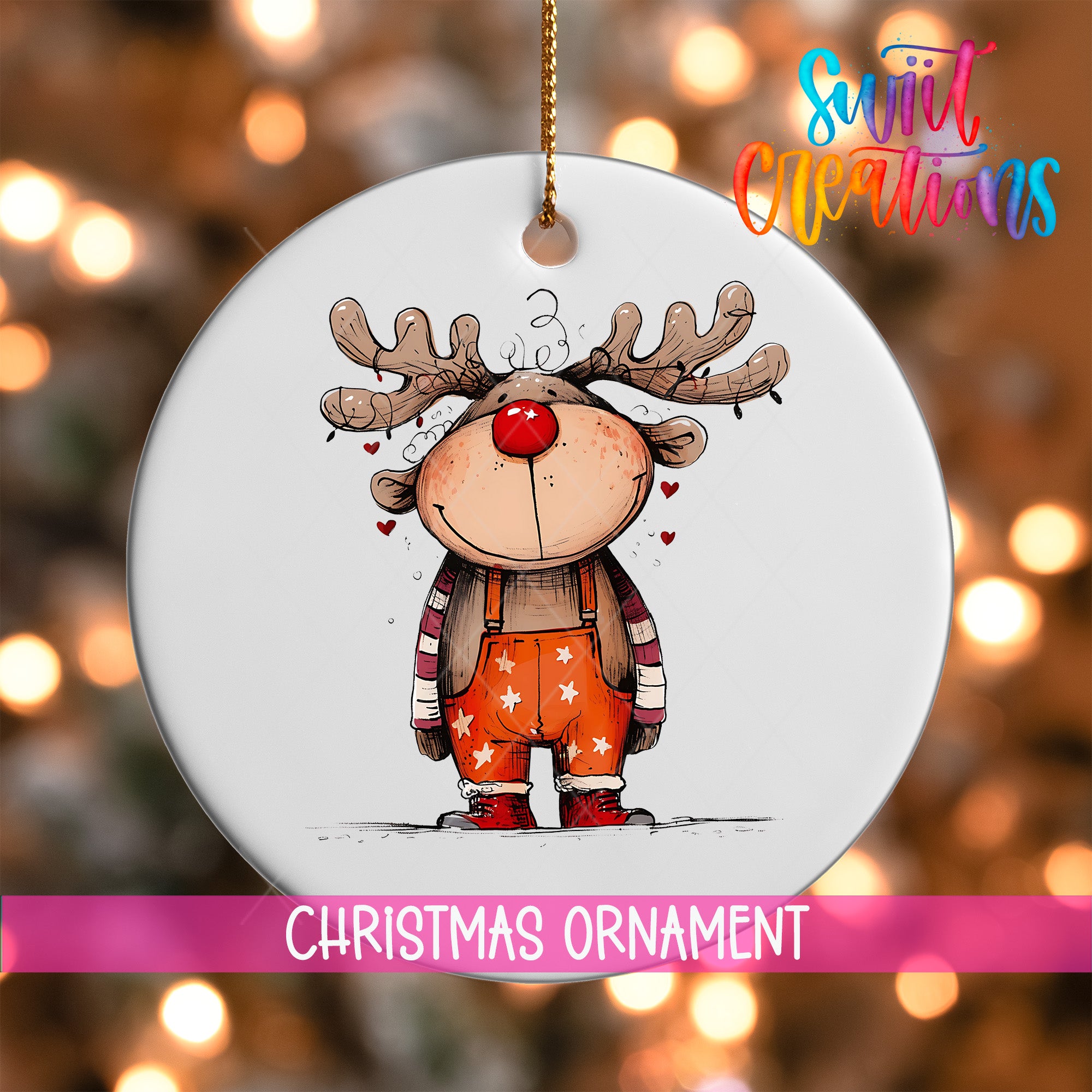 A white Christmas ornament featuring a cartoon reindeer with antlers and a red nose, wearing orange overalls with white stars.