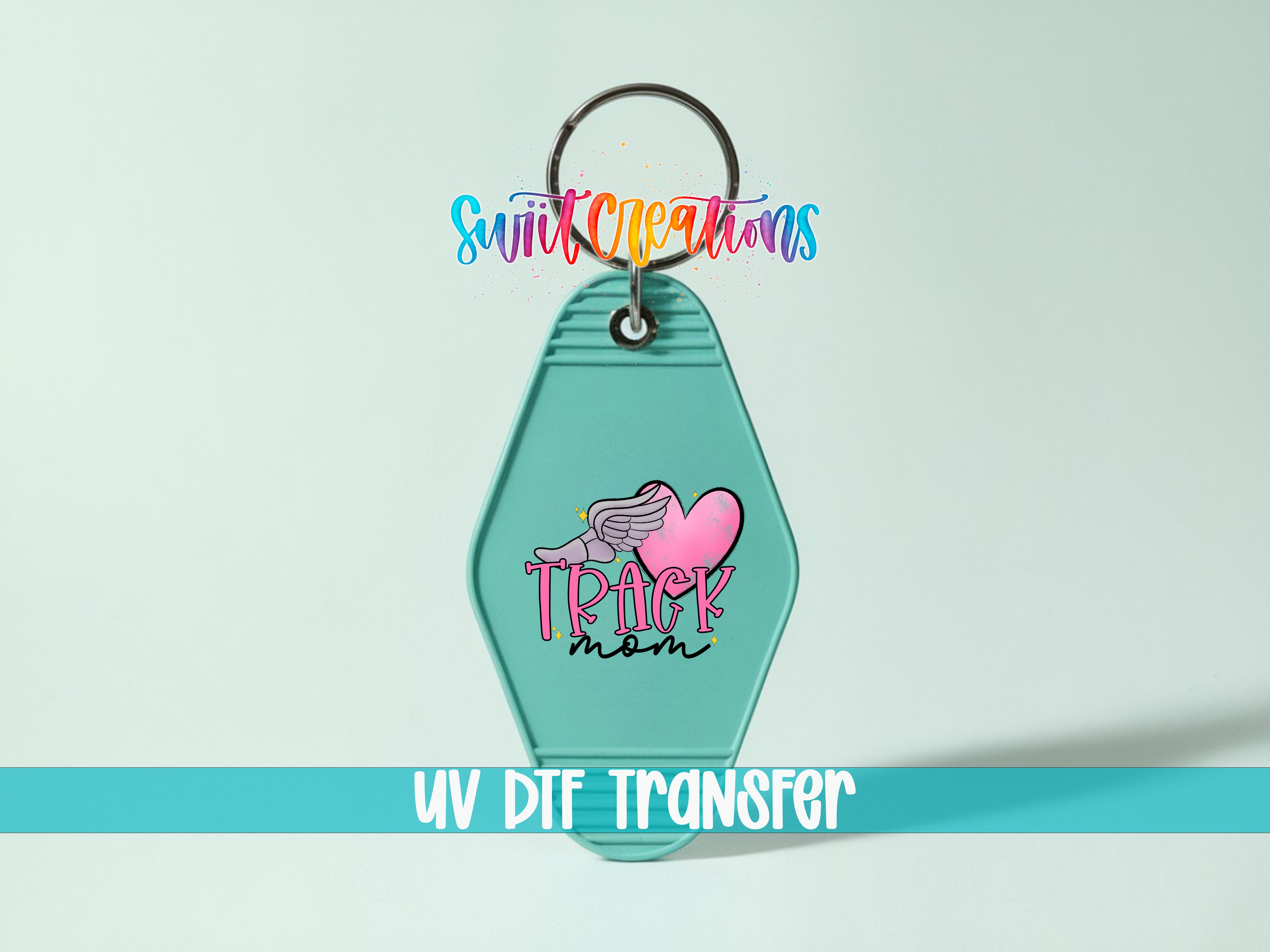 A keychain with a colorful design and text, including the words "Track mom" and "Swift creations".