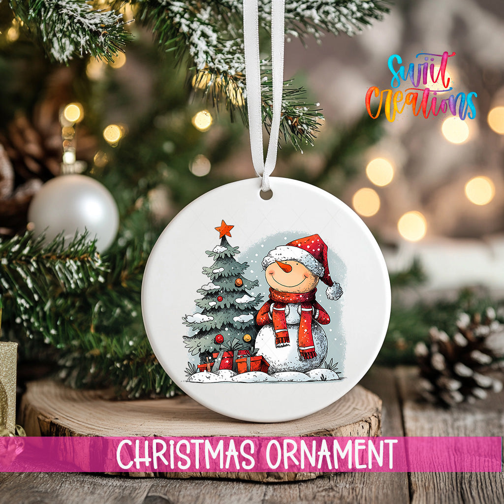 A white Christmas ornament featuring a snowman and a Christmas tree, with the text "Christmas Ornament" below it.