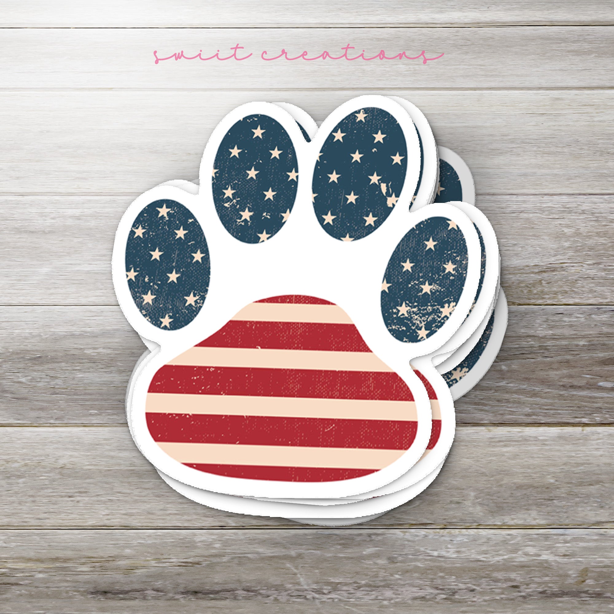 a sticker of a dog paw with the american flag on it