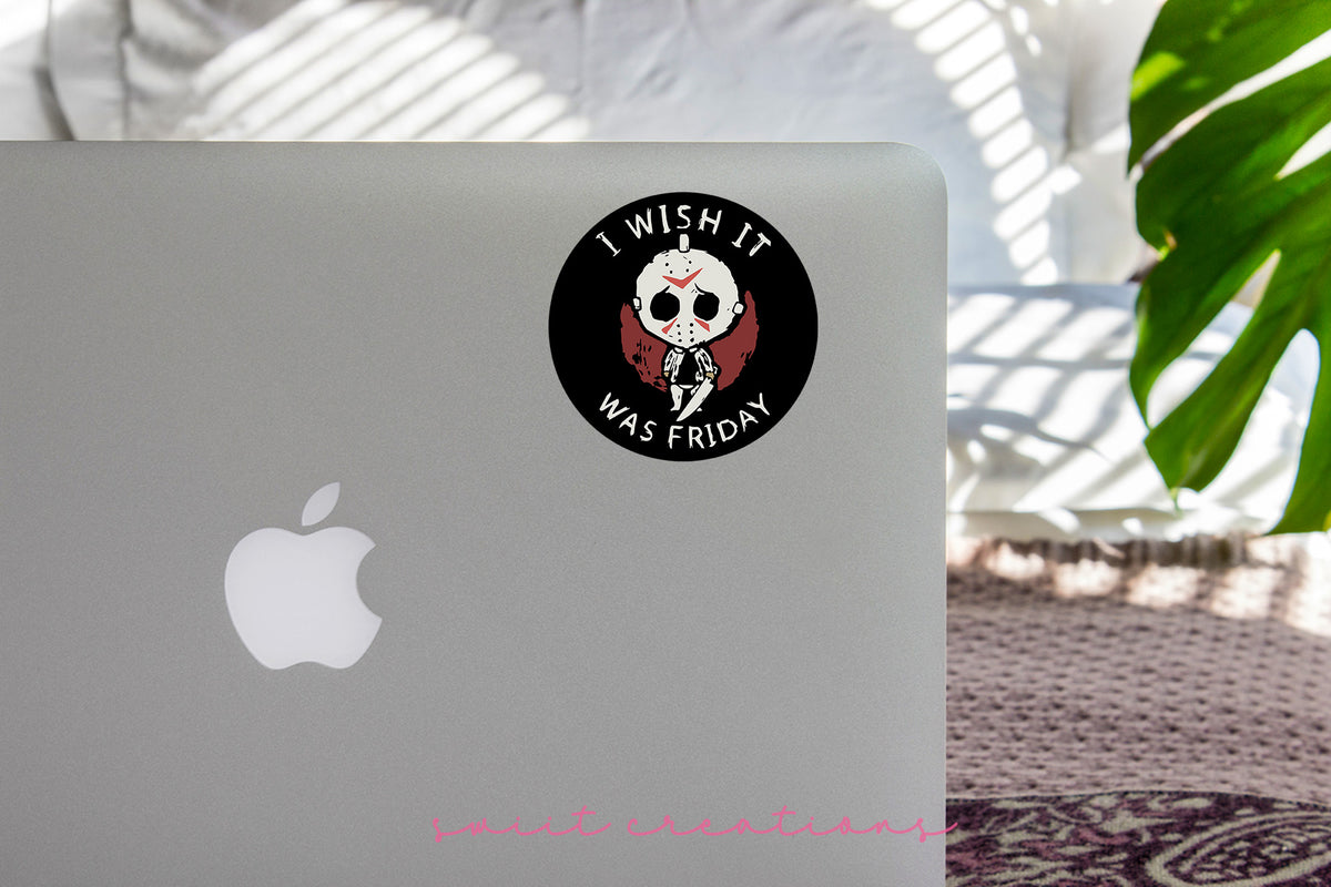 I Wish It Was Friday sticker on the lid of a silver laptop